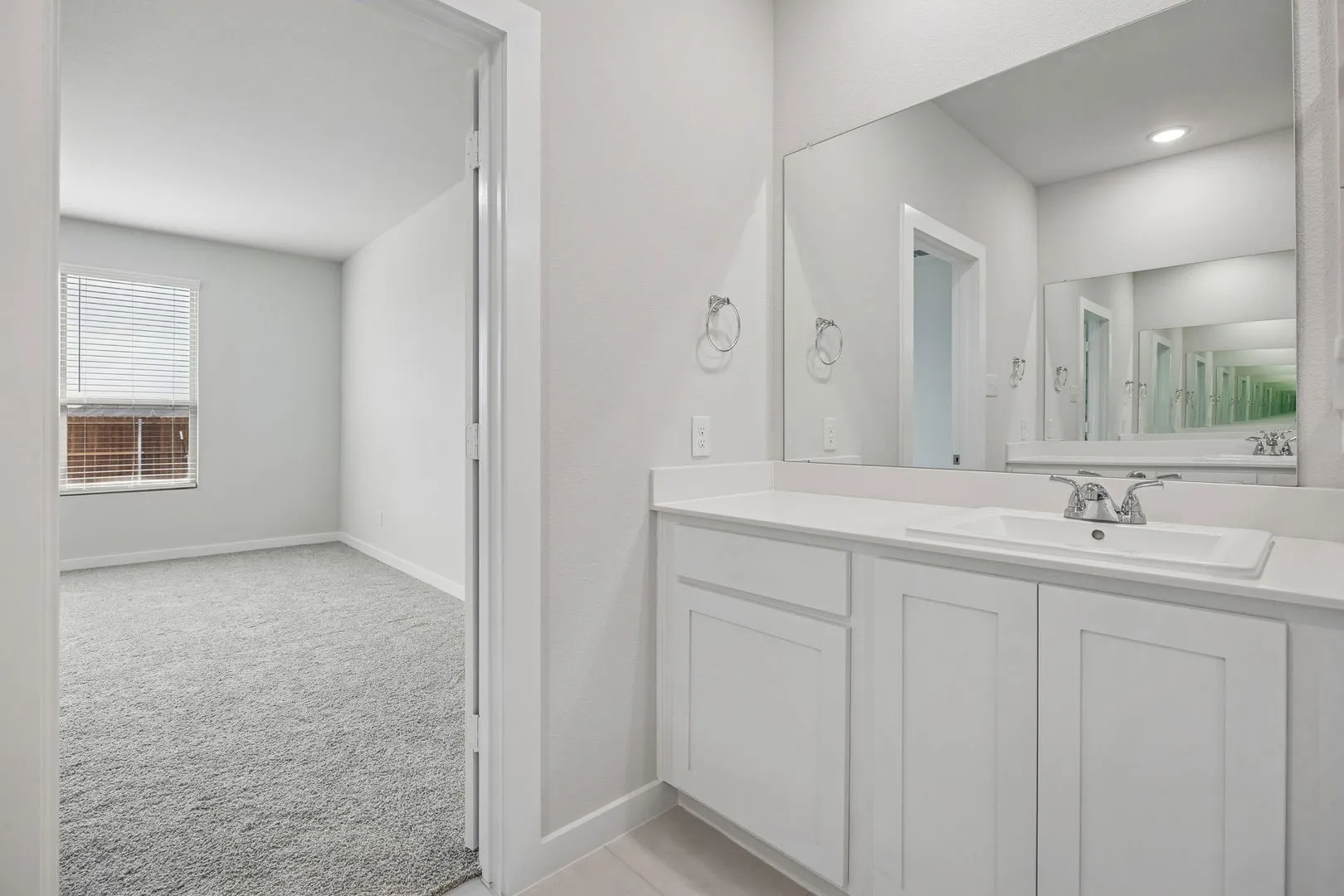 Primary Bathroom in the Masters home plan by Trophy Signature Homes – REPRESENTATIVE PHOTO
