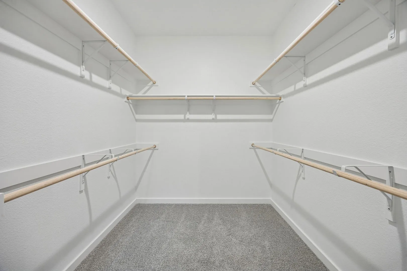Primary Closet in the Masters home plan by Trophy Signature Homes – REPRESENTATIVE PHOTO