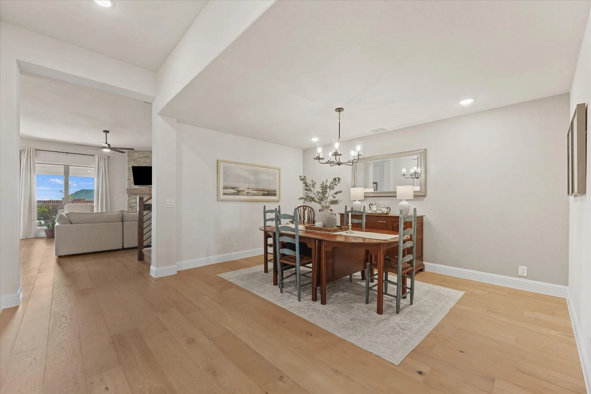 Open sightlines connect the formal dining room to the main living area while engineered hardwood flooring continues throughout much of the first floor. This Carolina III floor plan offers multiple living spaces without sacrificing bedroom count.