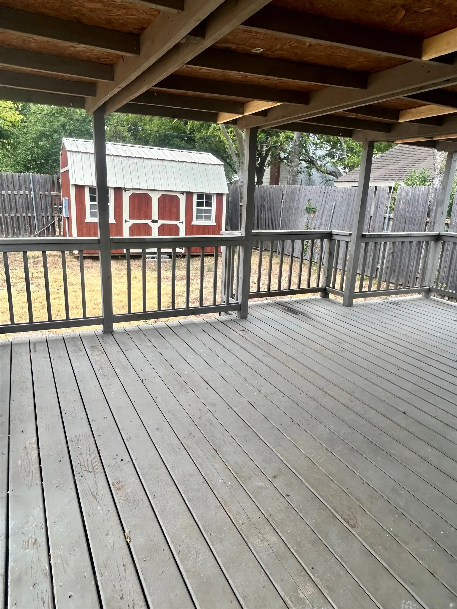 Large covered back deck. Large storage shed.