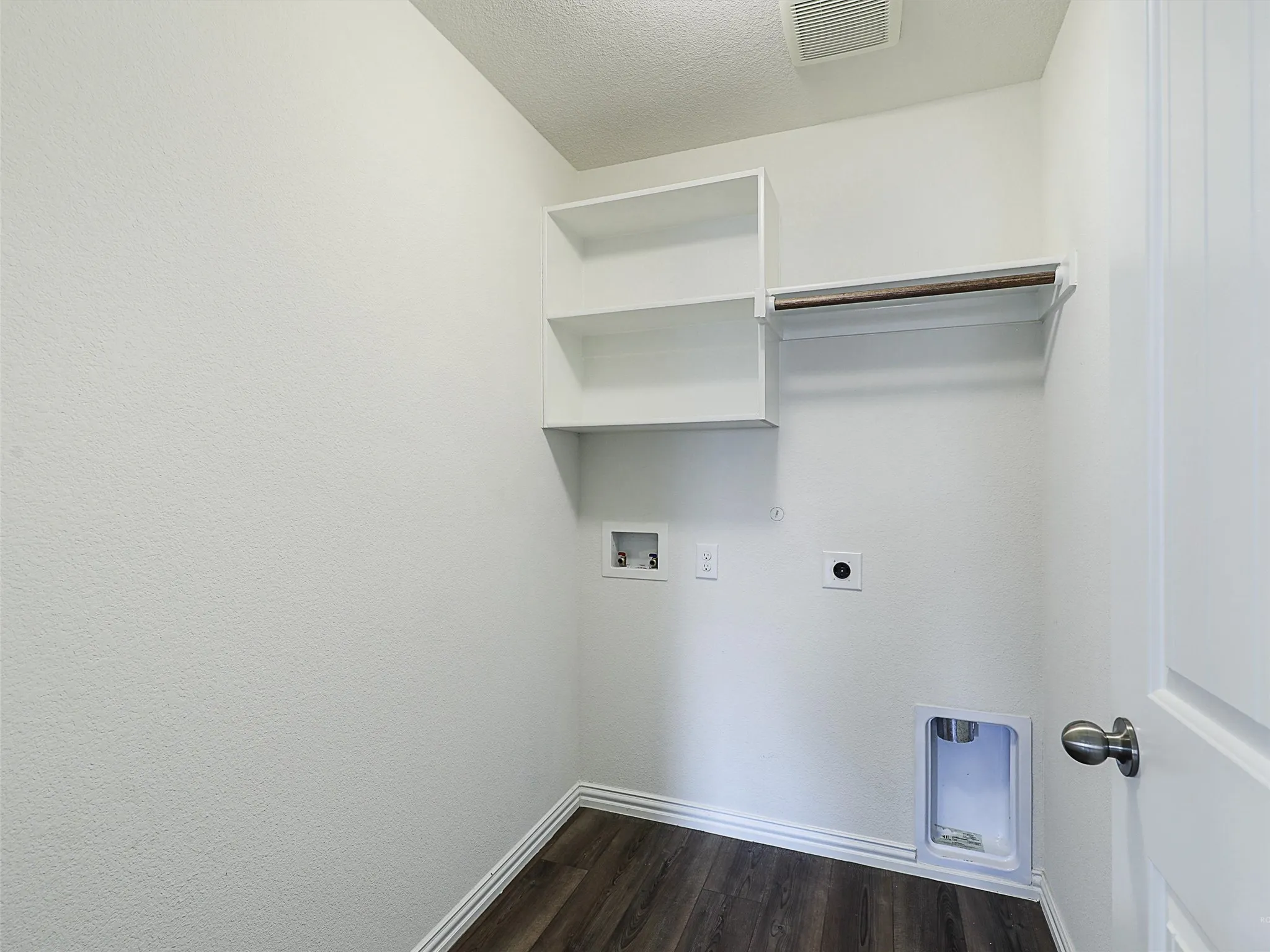 Laundry room with shelving