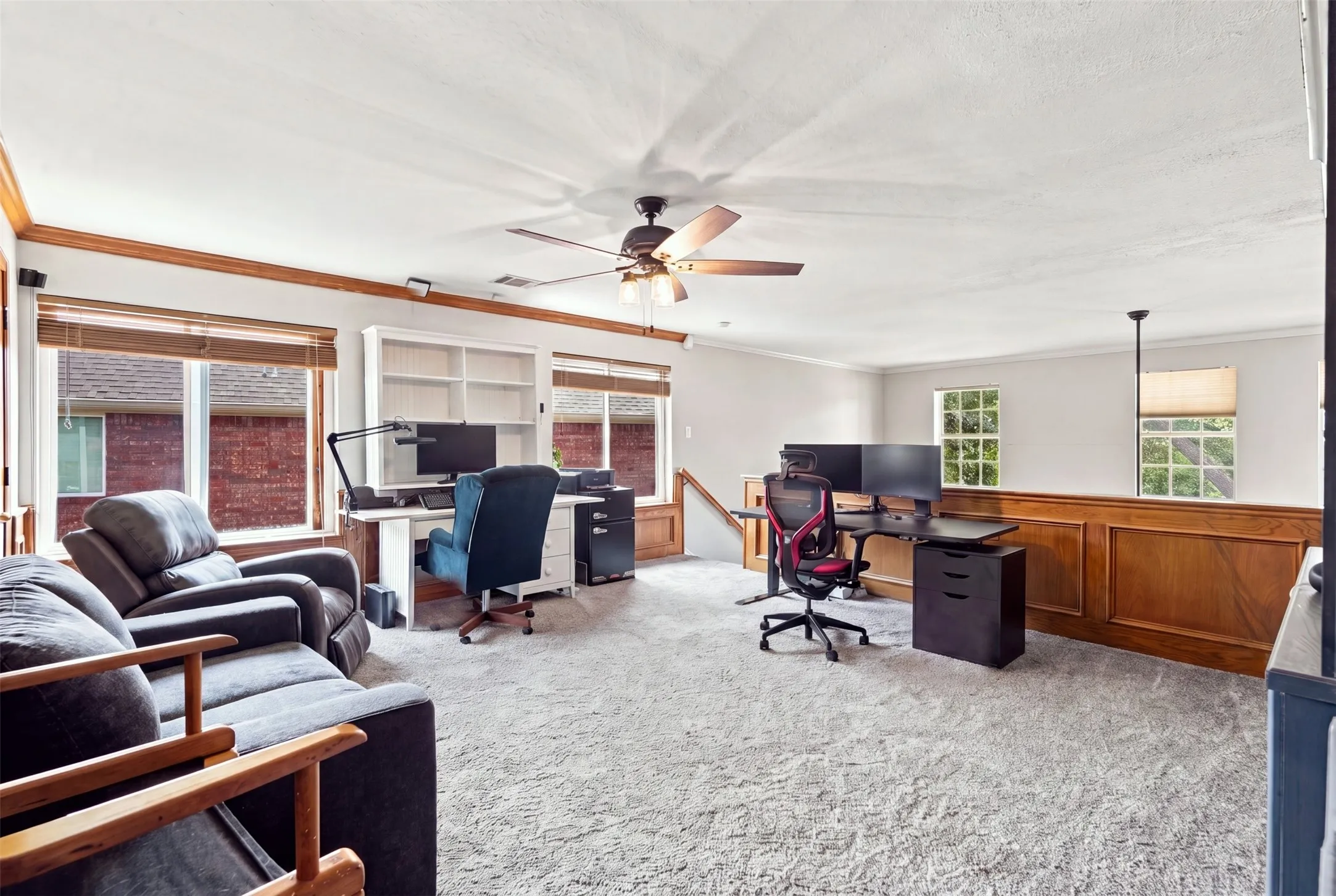 This lounge area has stairs to the primary bedroom, it can be used as an office