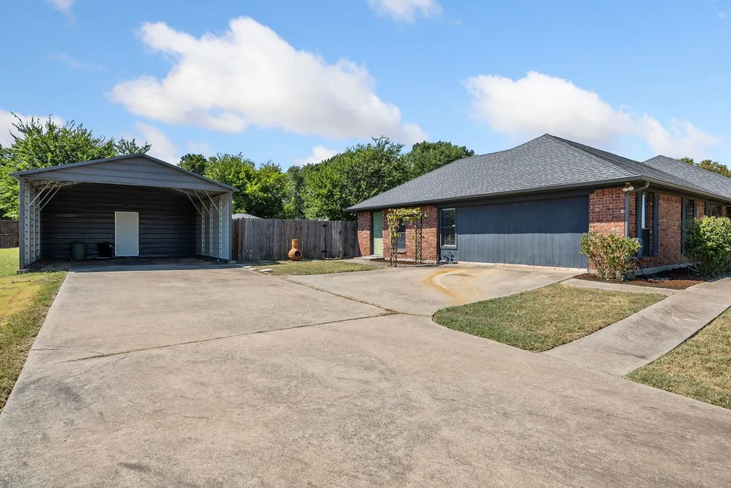 2 Car Covered Parking with Entrance to Garage Apartment and Plenty of Additional Parking.