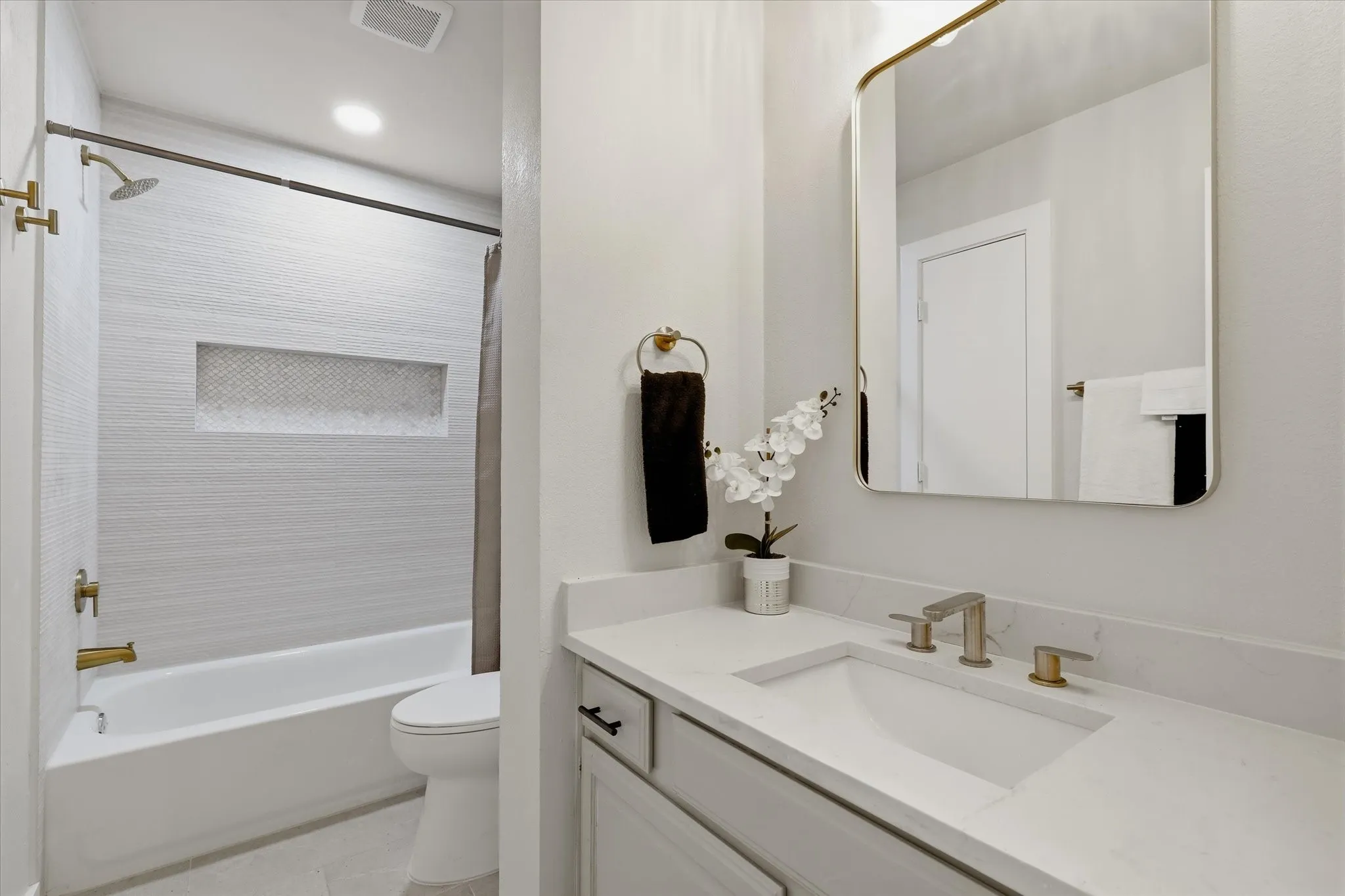 Modern vanity with an integrated sink and light-toned countertop