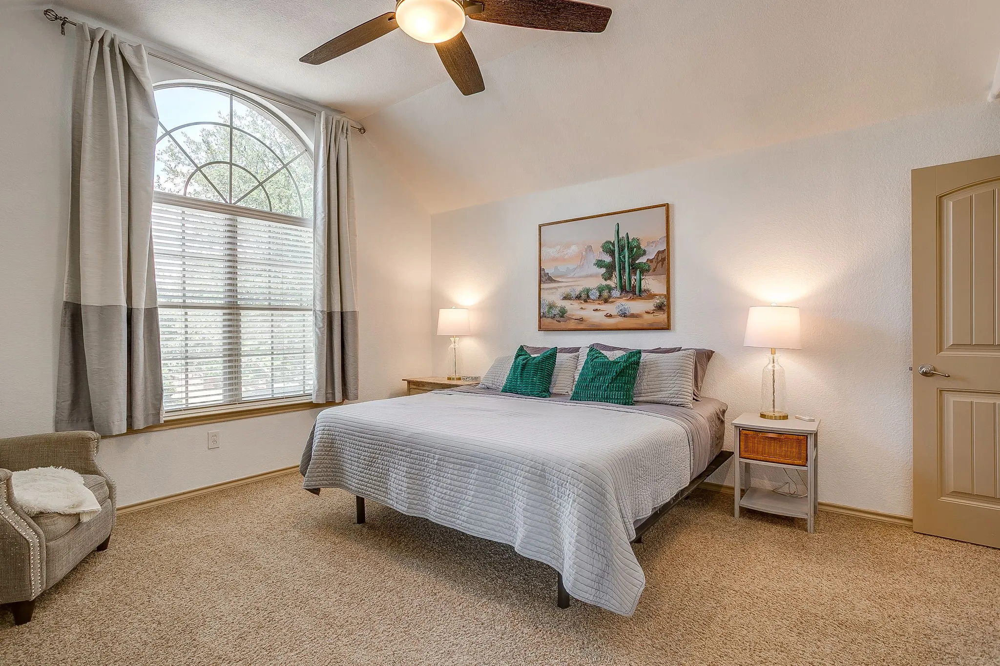 Primary suite is spacious with ceiling fan and 2 enormous closets.