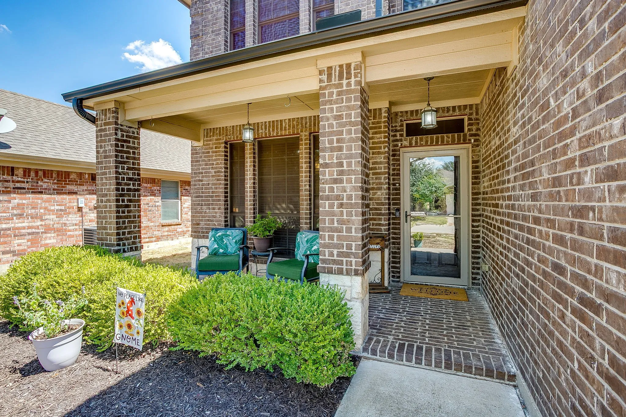 Inviting front porch.  NEW HVAC and Roof is approximately 3 years old.  Solar screens on the front of the property.