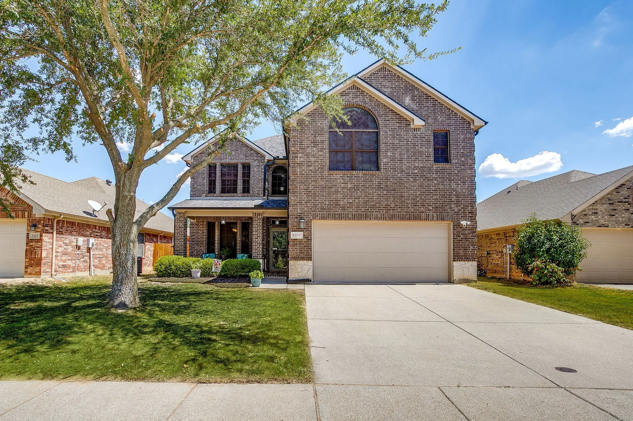 Mature trees, 2 car garage, wonderful front porch.    Digitally enhanced grass.