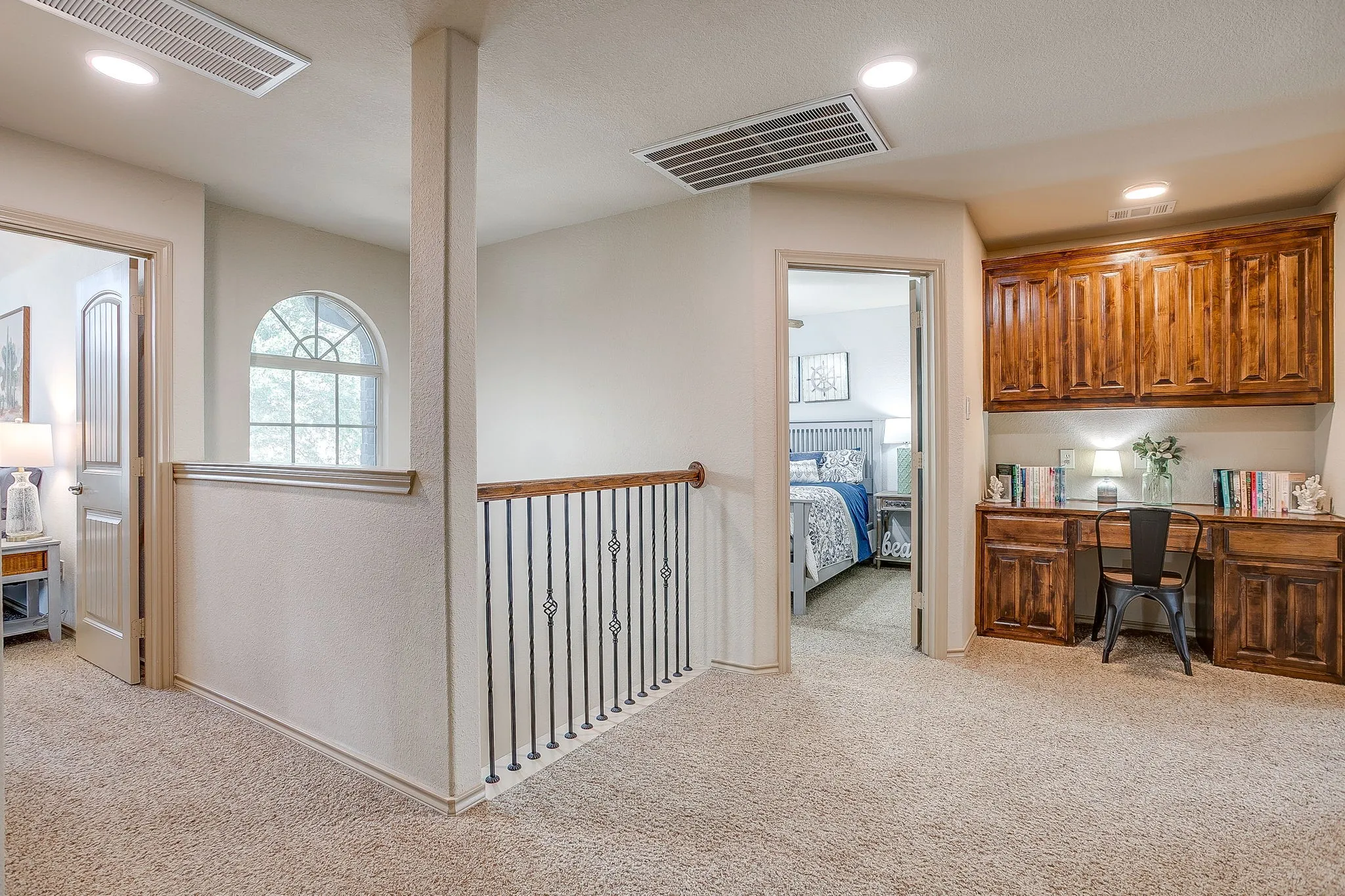 Upstairs landing with built ins.
