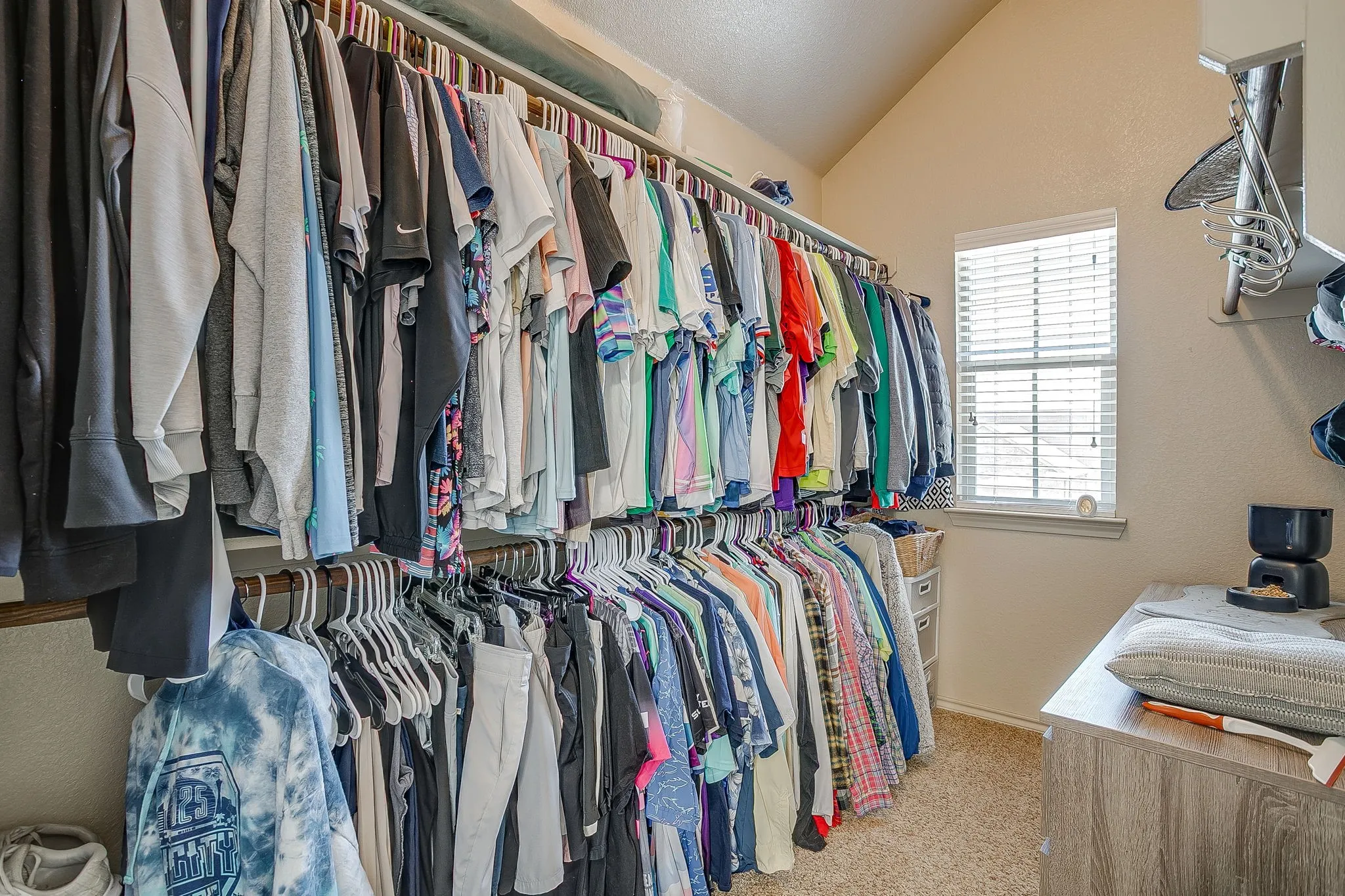 Closet number 2 is in the primary bathroom.  Natural light and tons of hanging space.