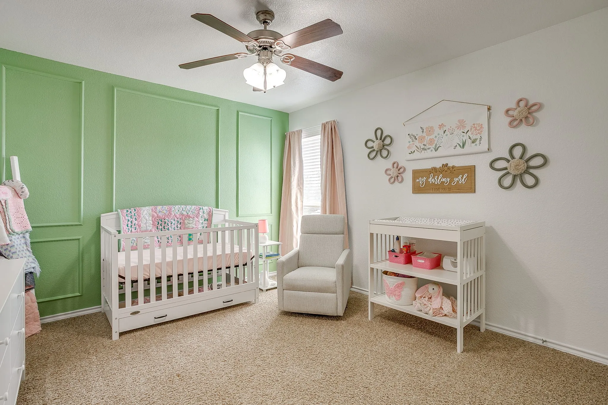 Upstairs bedroom 2 with accent wall, picture frame trim, ceiling fan and good sized closet.