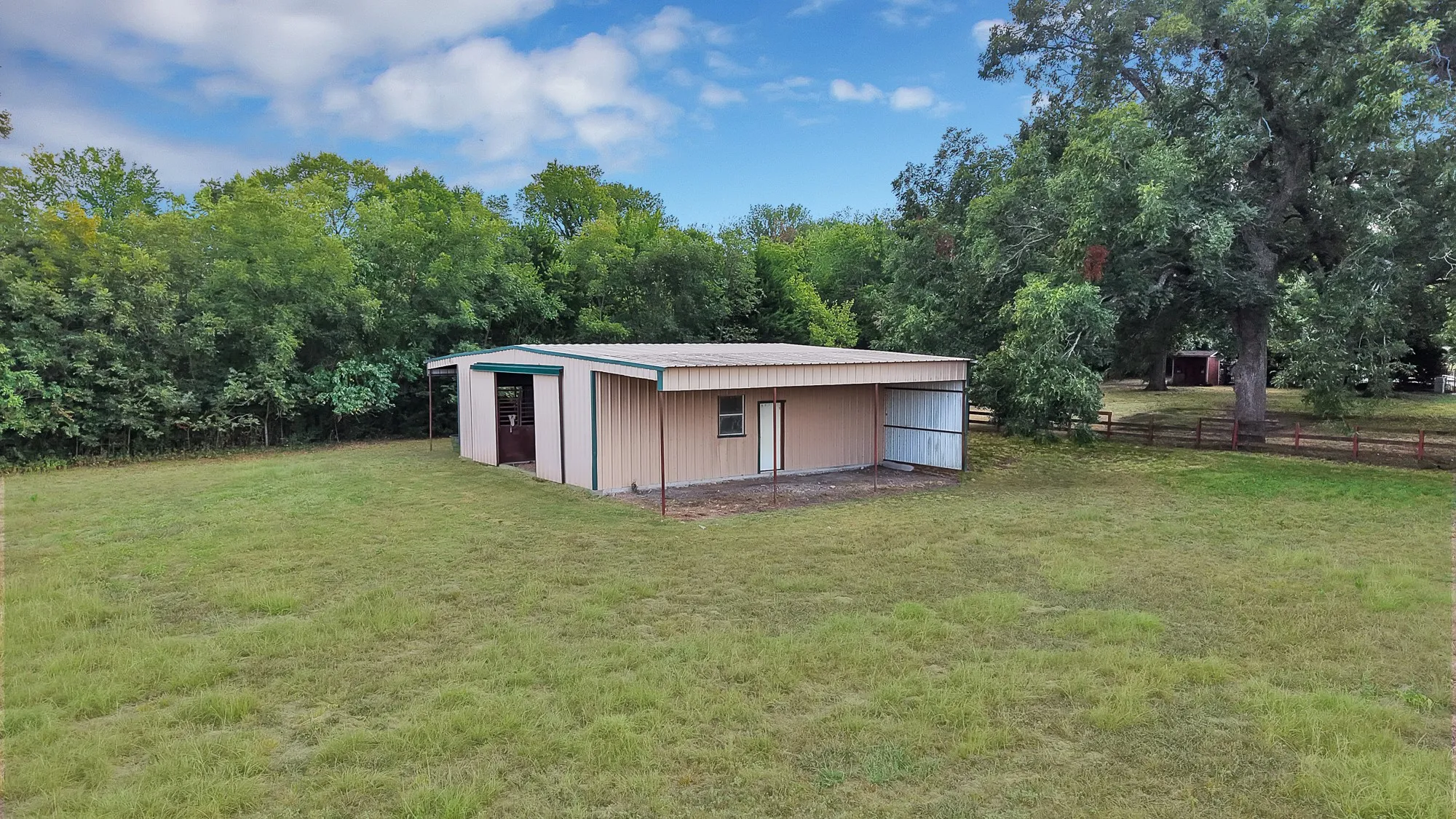 36 x 36 steel barn, 2 stalls, and a tack room.