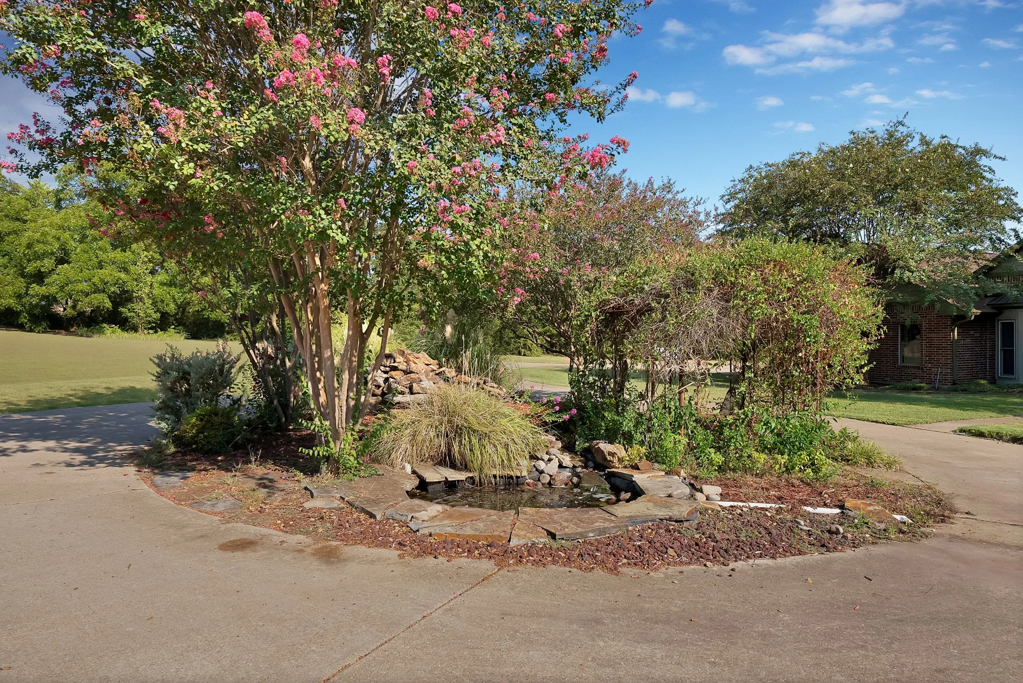 Waterfall feature in parking entry.