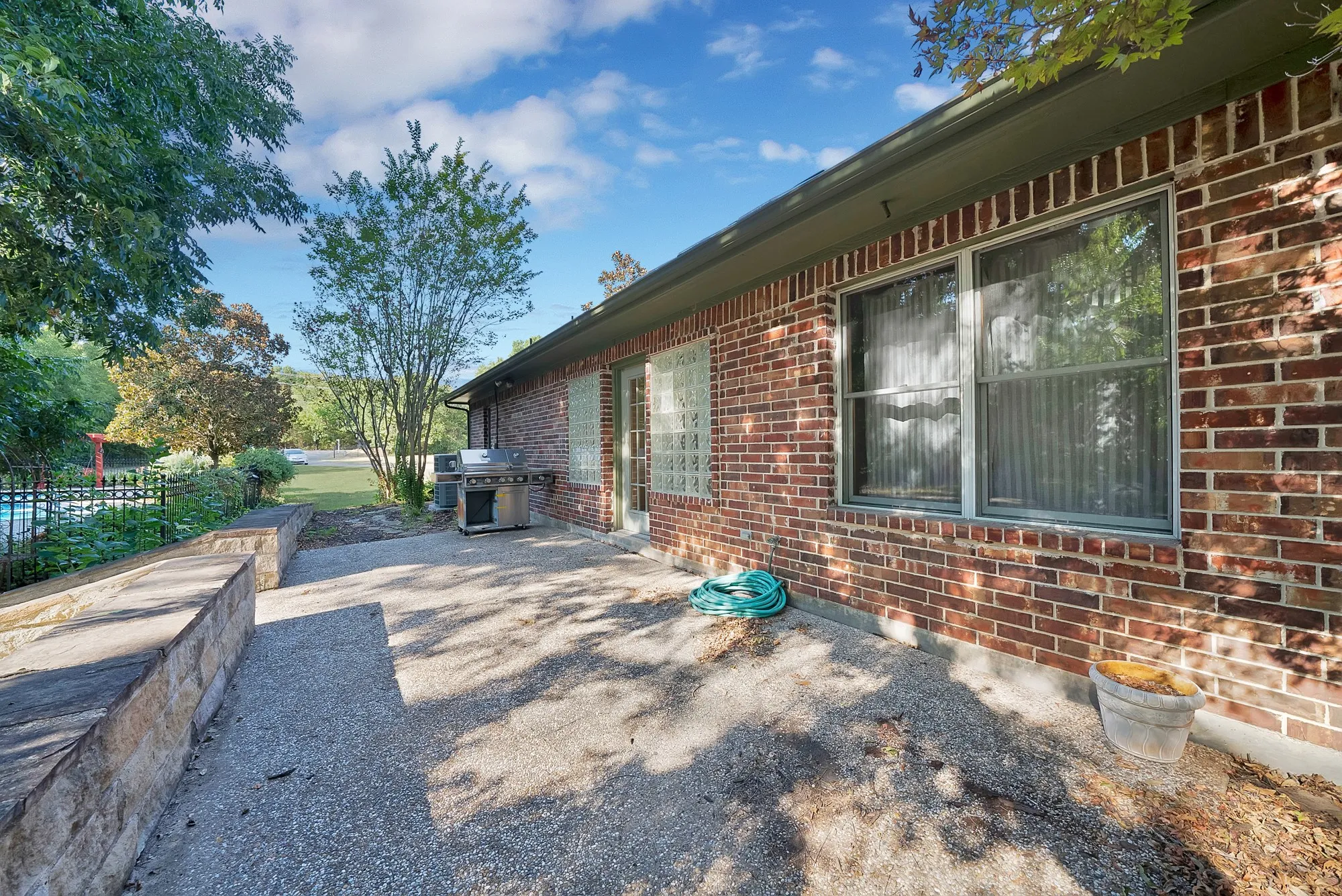 Side patio near the pool, great for entertaining.