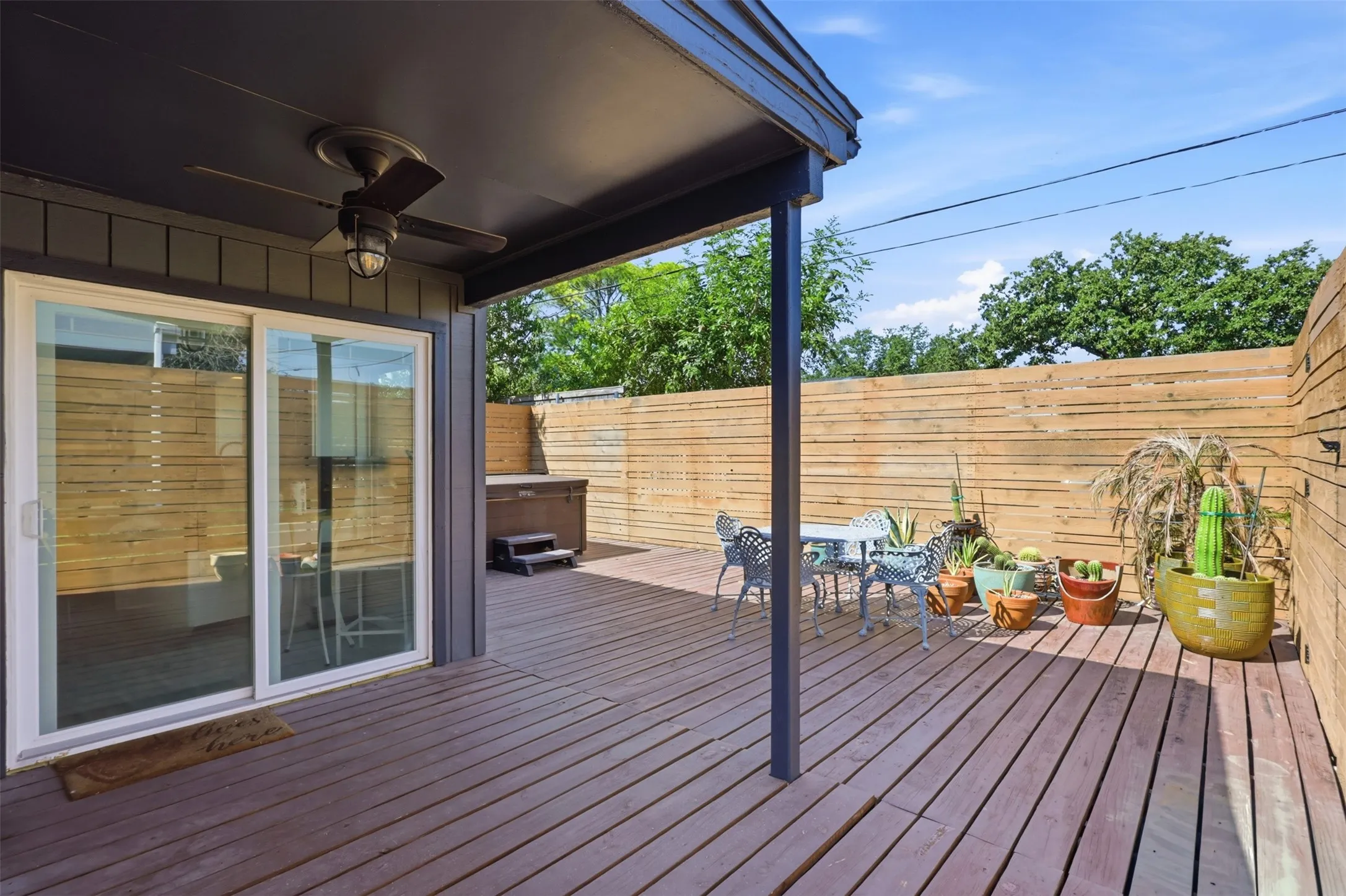 Covered outdoor living area creates a shaded spot to enjoy the backyard year-round.