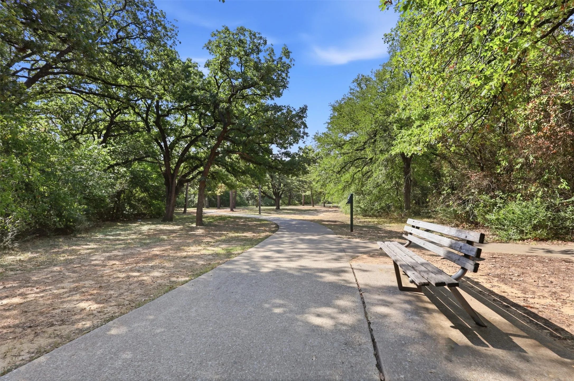 Enjoy nearby walking trails and mature trees at Rickel Park.