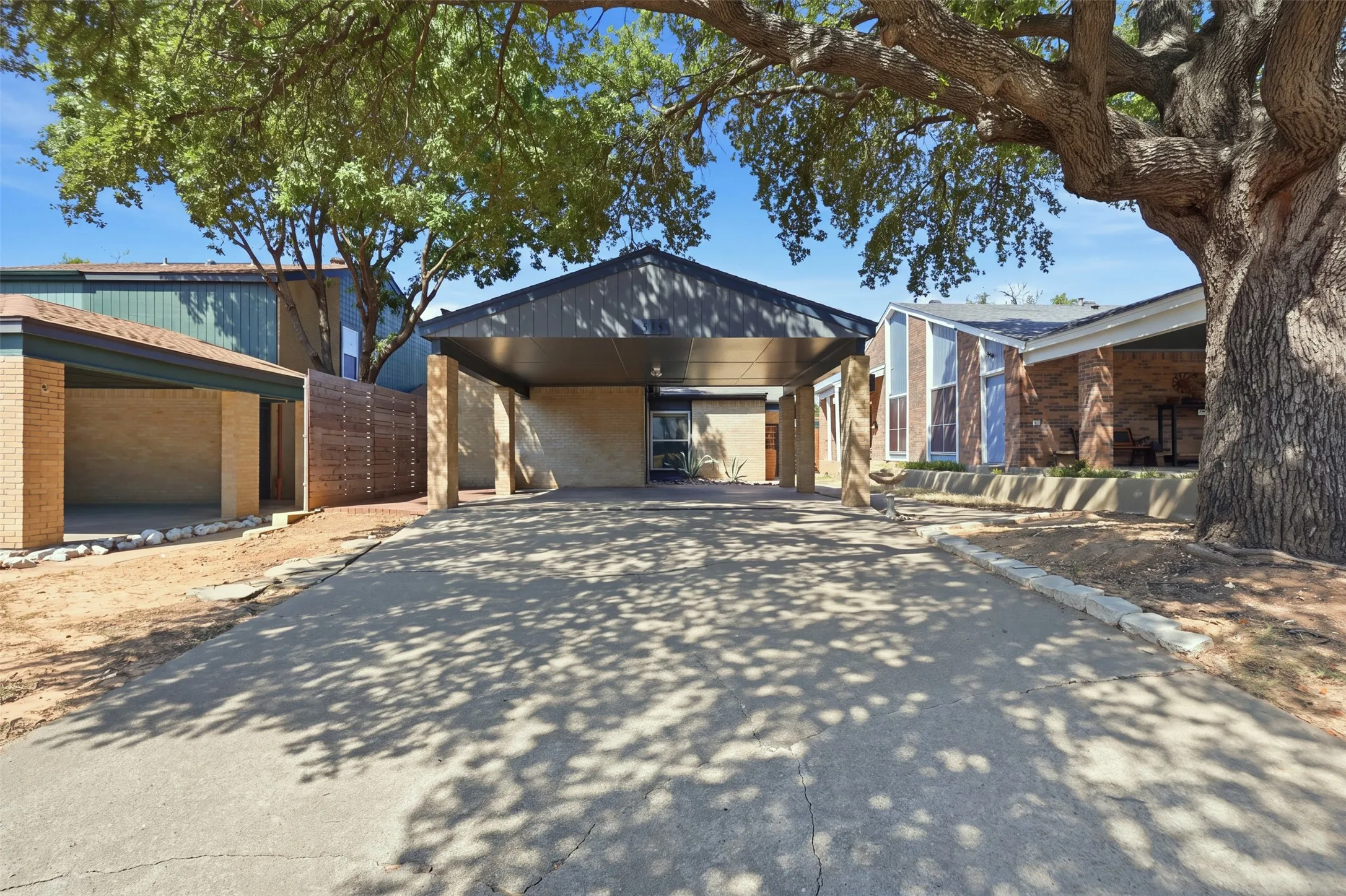 Welcoming front exterior with covered parking and convenient walkway to the entrance.