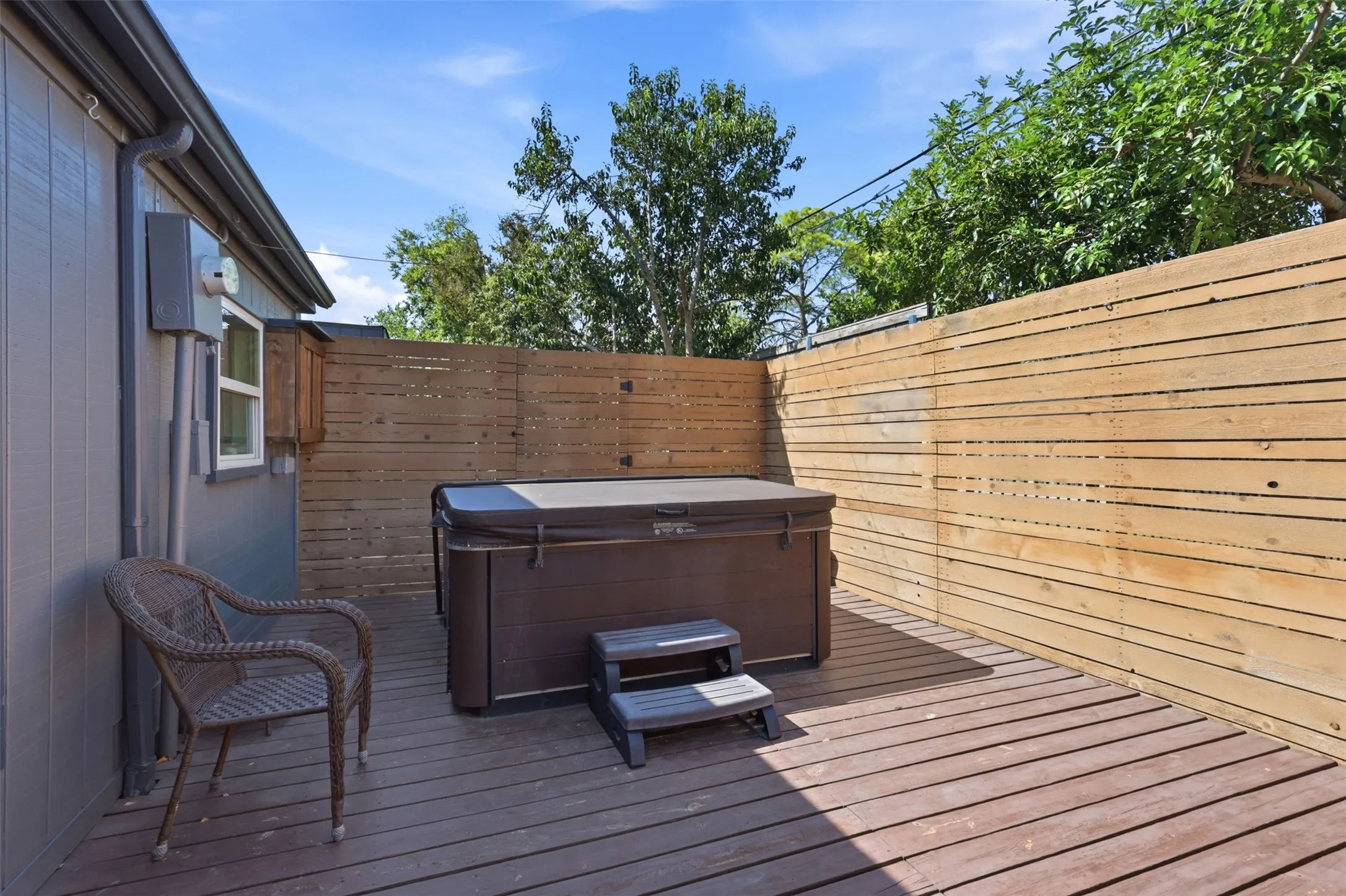 Additional private deck space offers plenty of room for outdoor seating or a spa setup.
