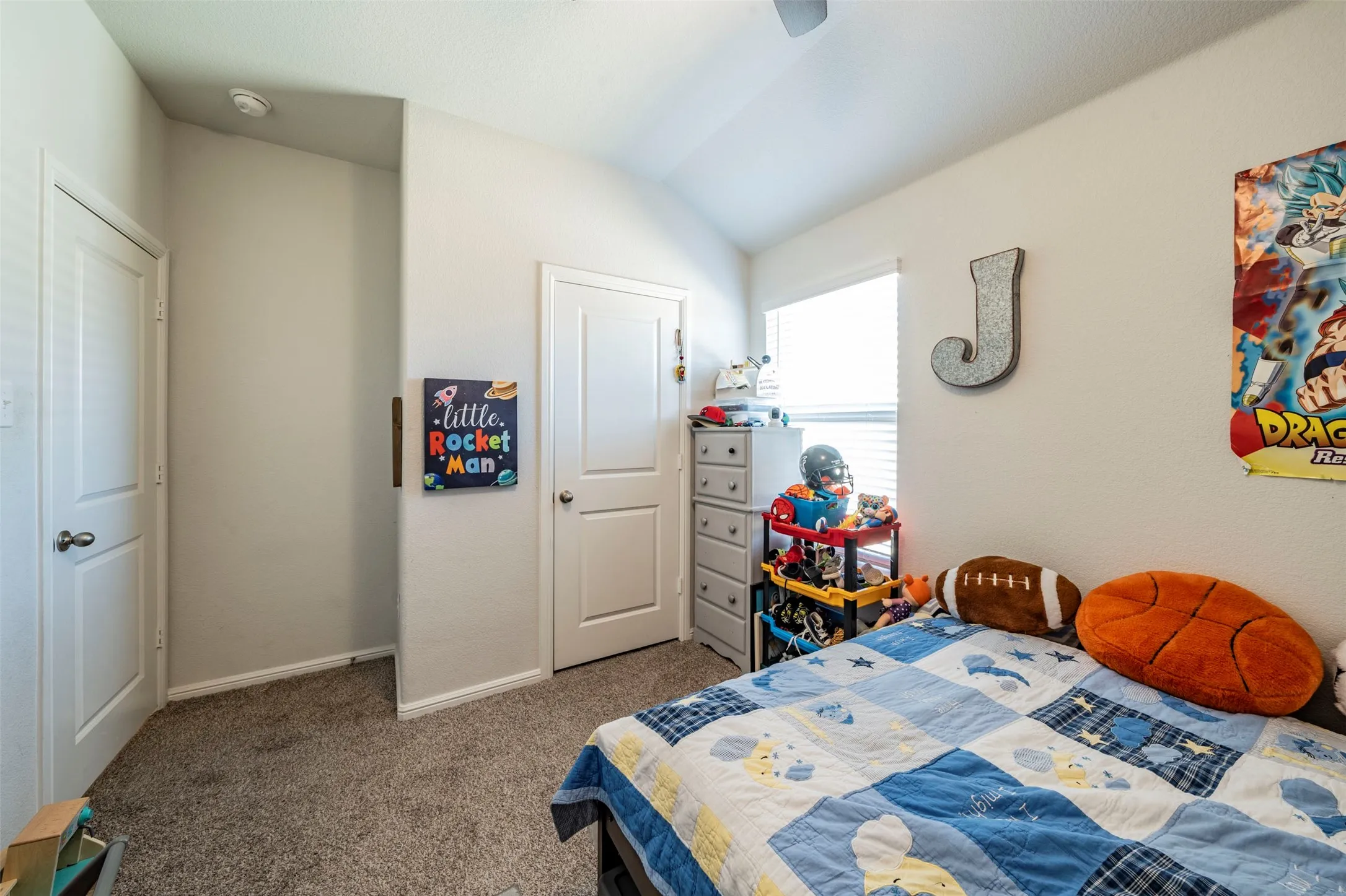 Light-toned walls with textured carpeting throughout