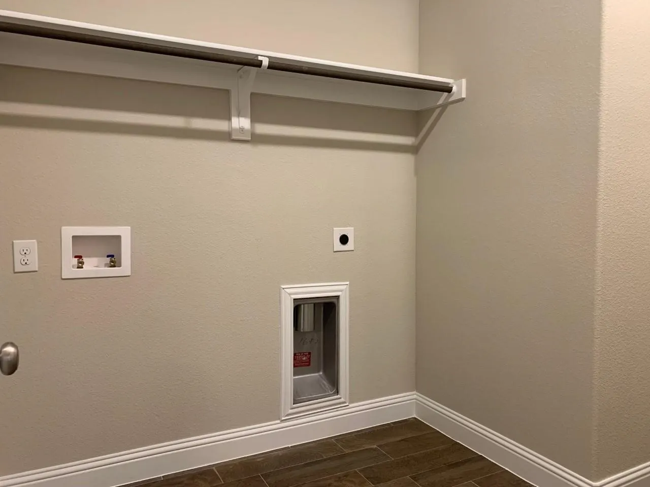 Hard-surface flooring, integrated shelving, and a metal hanging rod