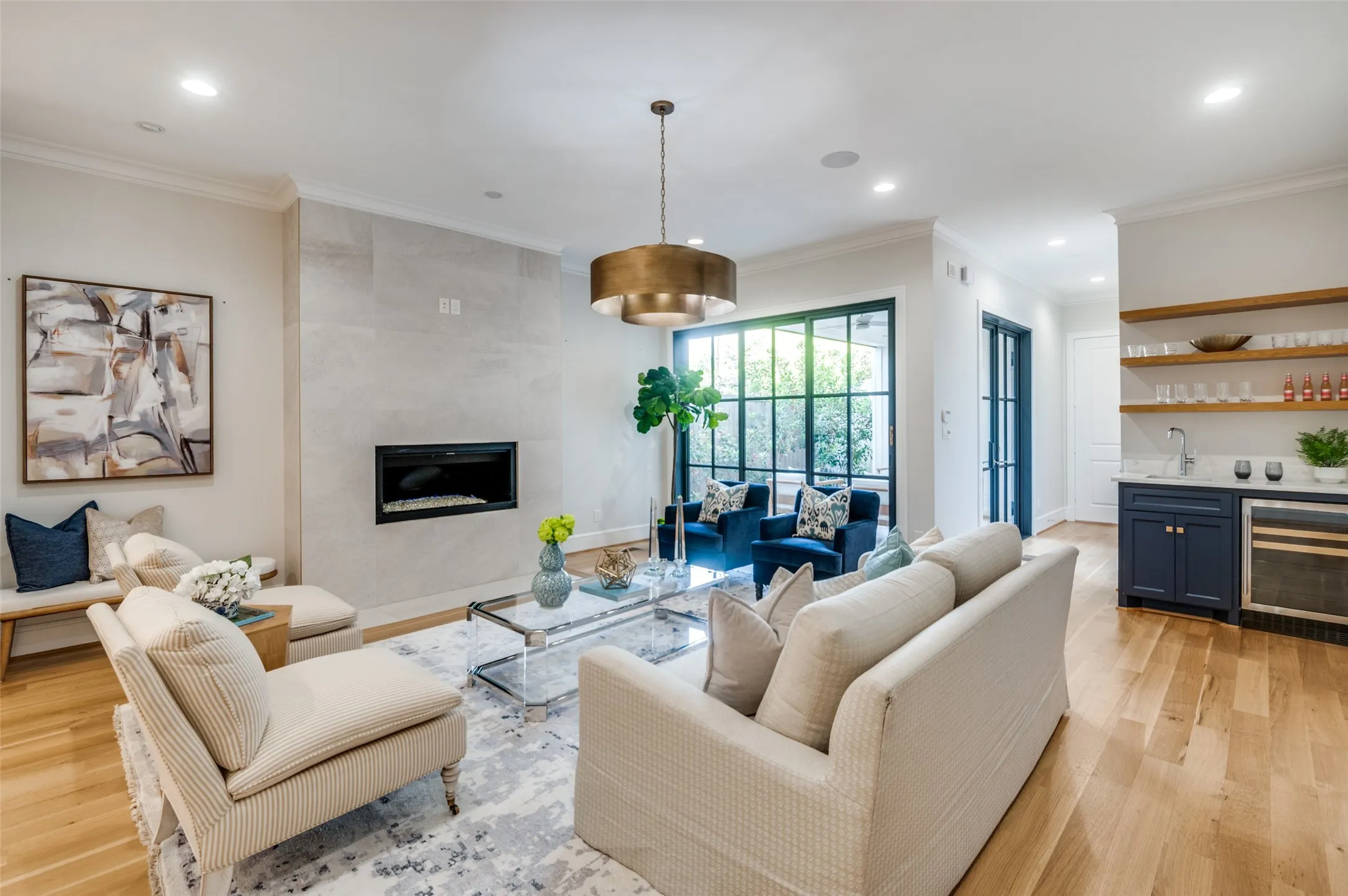 Hardwood flooring, recessed lighting, and crown molding