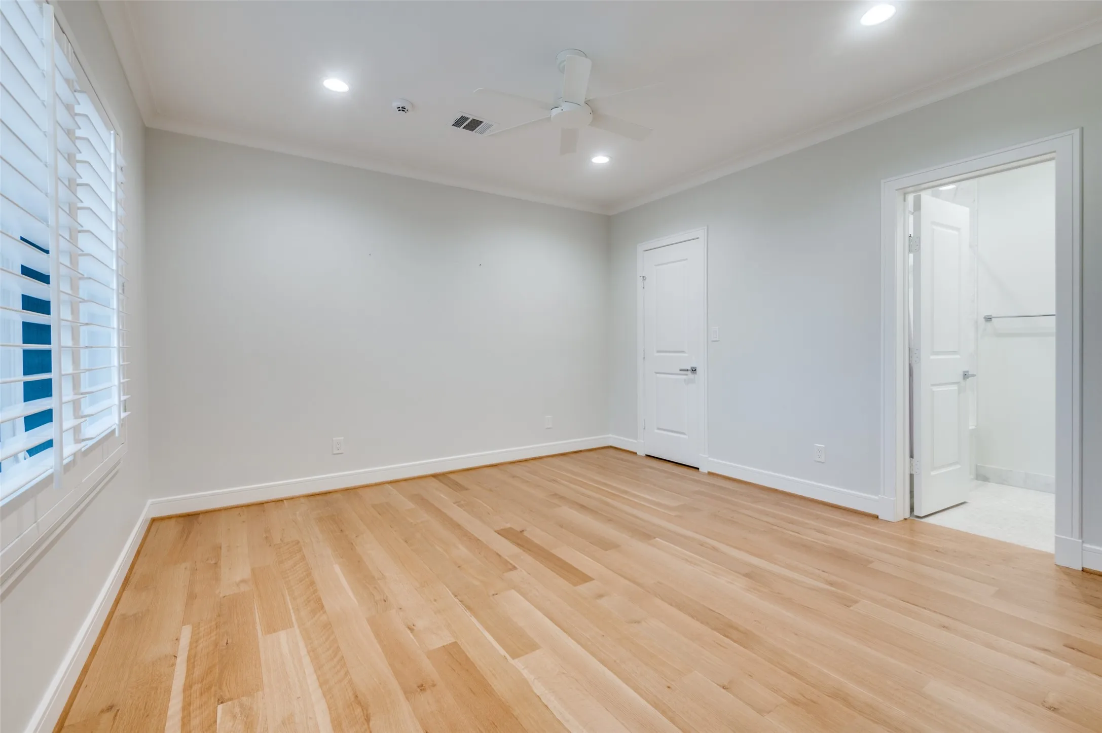 Hardwood flooring, recessed lighting, crown molding, plantation shutters, and a ceiling fan