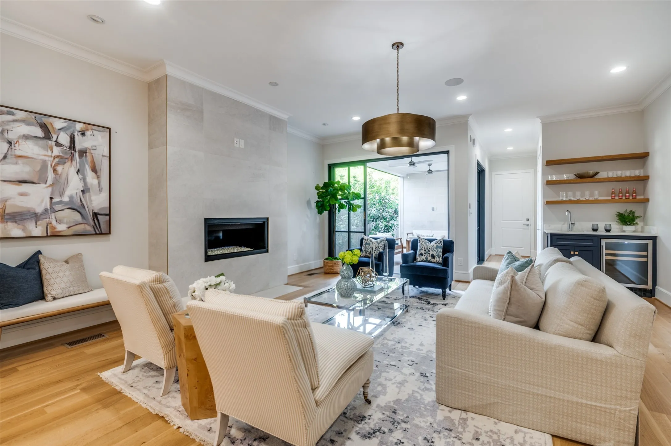 Hardwood flooring, recessed lighting, and crown molding