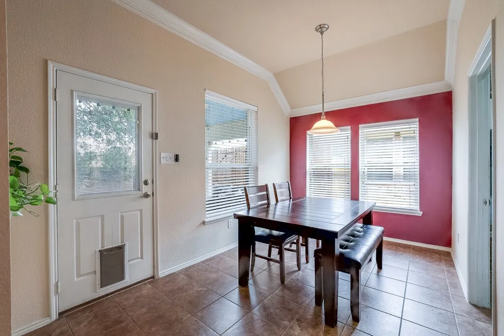 Casual dining area just steps from both the kitchen and outside entertainment deck.