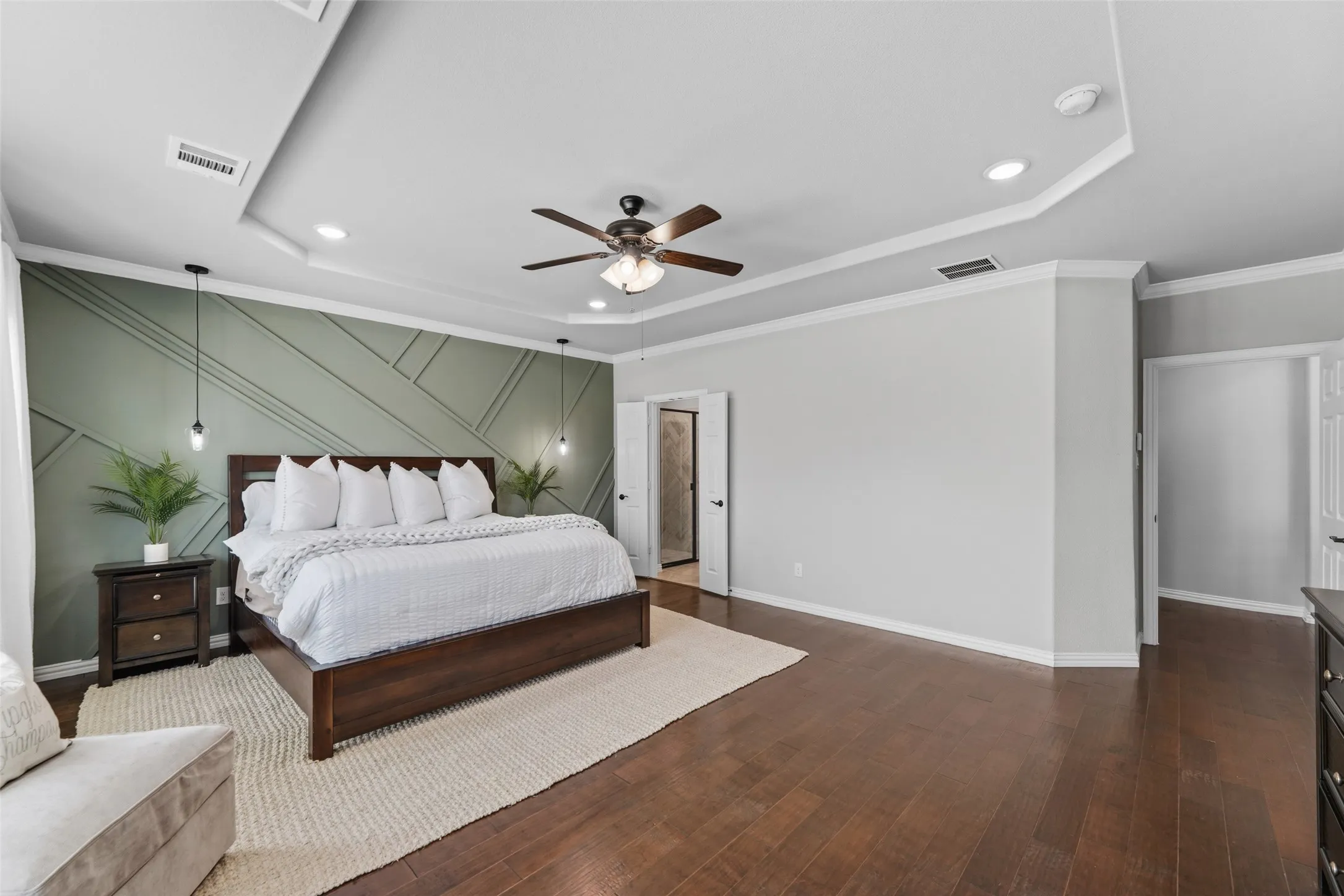 Tray ceiling with recessed lighting and crown molding
