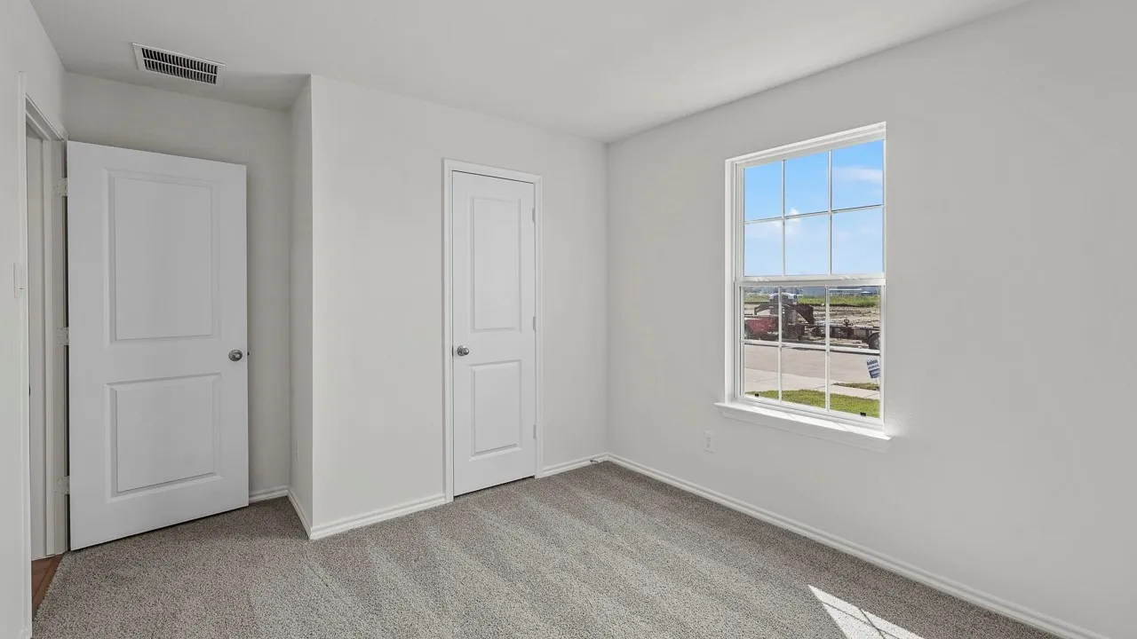 Light-toned wall paint with carpeted flooring