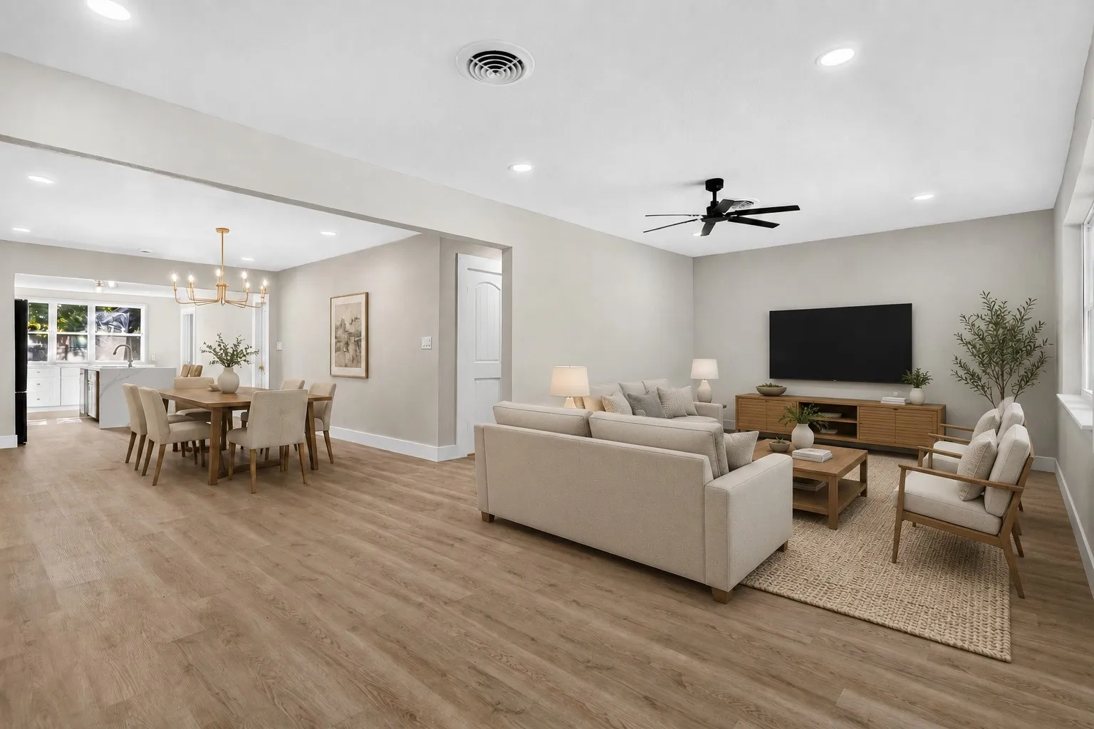 AI Staged: Open-concept living and dining area featuring wood-finish flooring, recessed lighting, and a modern ceiling fan