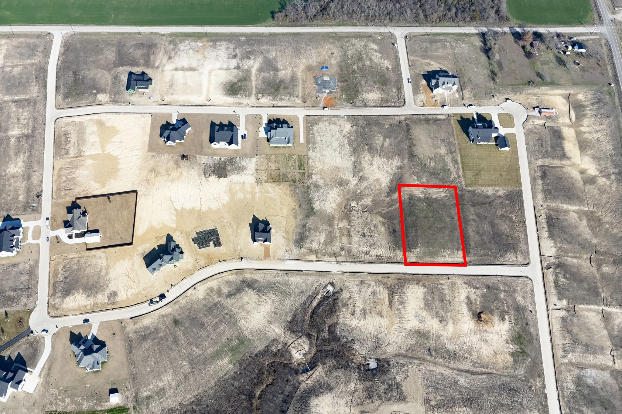 Aerial Survey. Depicting a residential development with an outlined parcel within the property
