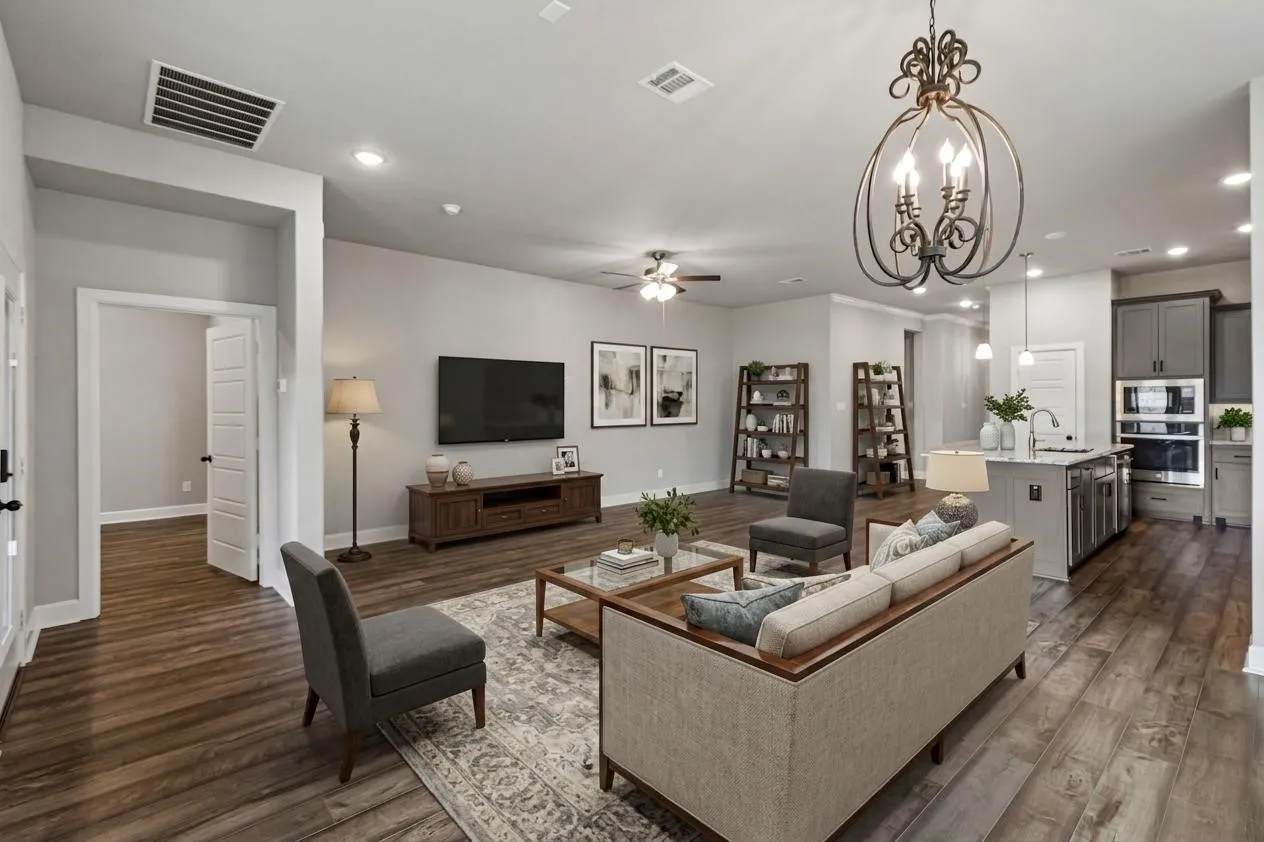 Wood-finish flooring throughout, recessed lighting, and a decorative chandelier