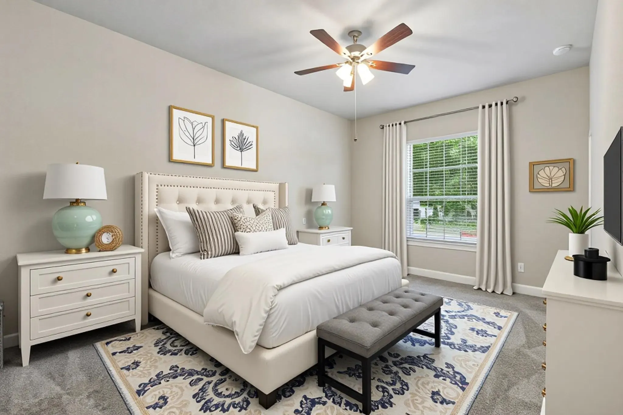 Plush carpeting, large window with blinds, ceiling fan, and light neutral wall color