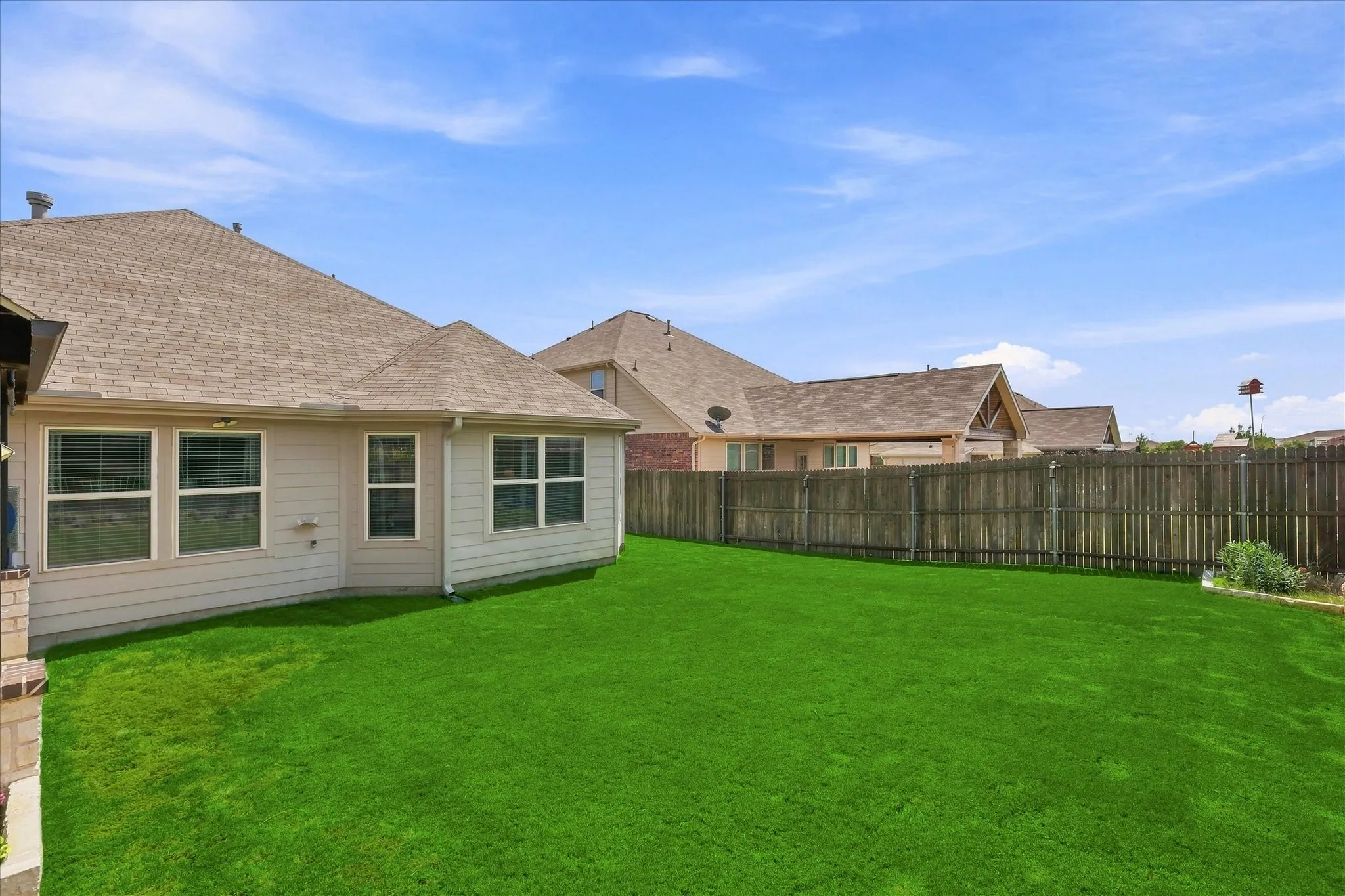 The Extra Large Fenced Back Yard provides Plenty of Space for Outdoor Activities.