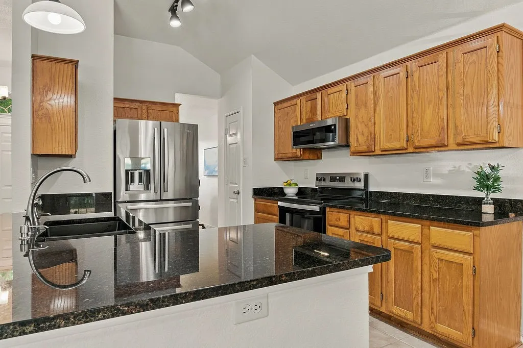 Granite countertops and stainless steel appliances