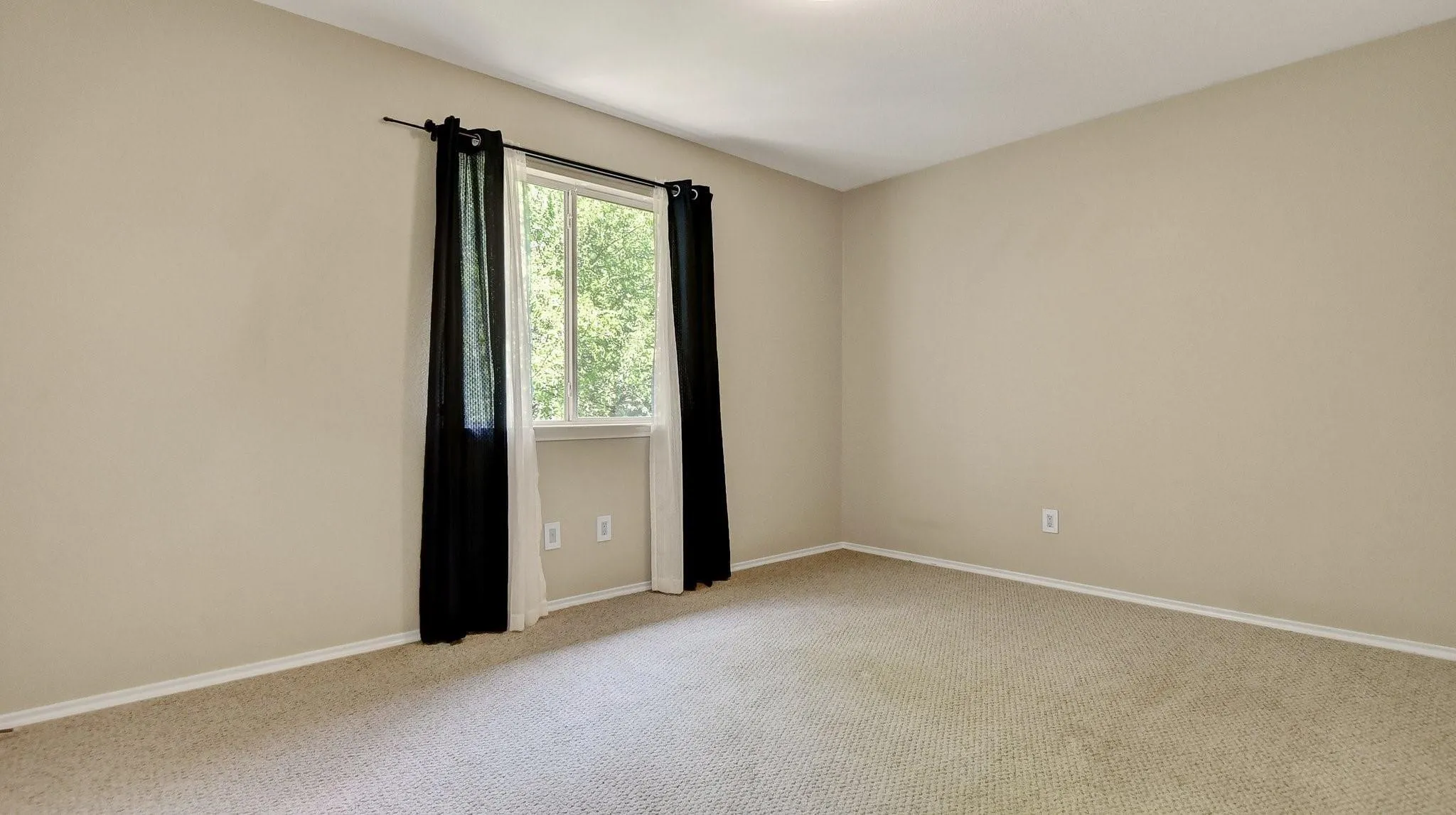 Neutral wall finishes and carpeted flooring