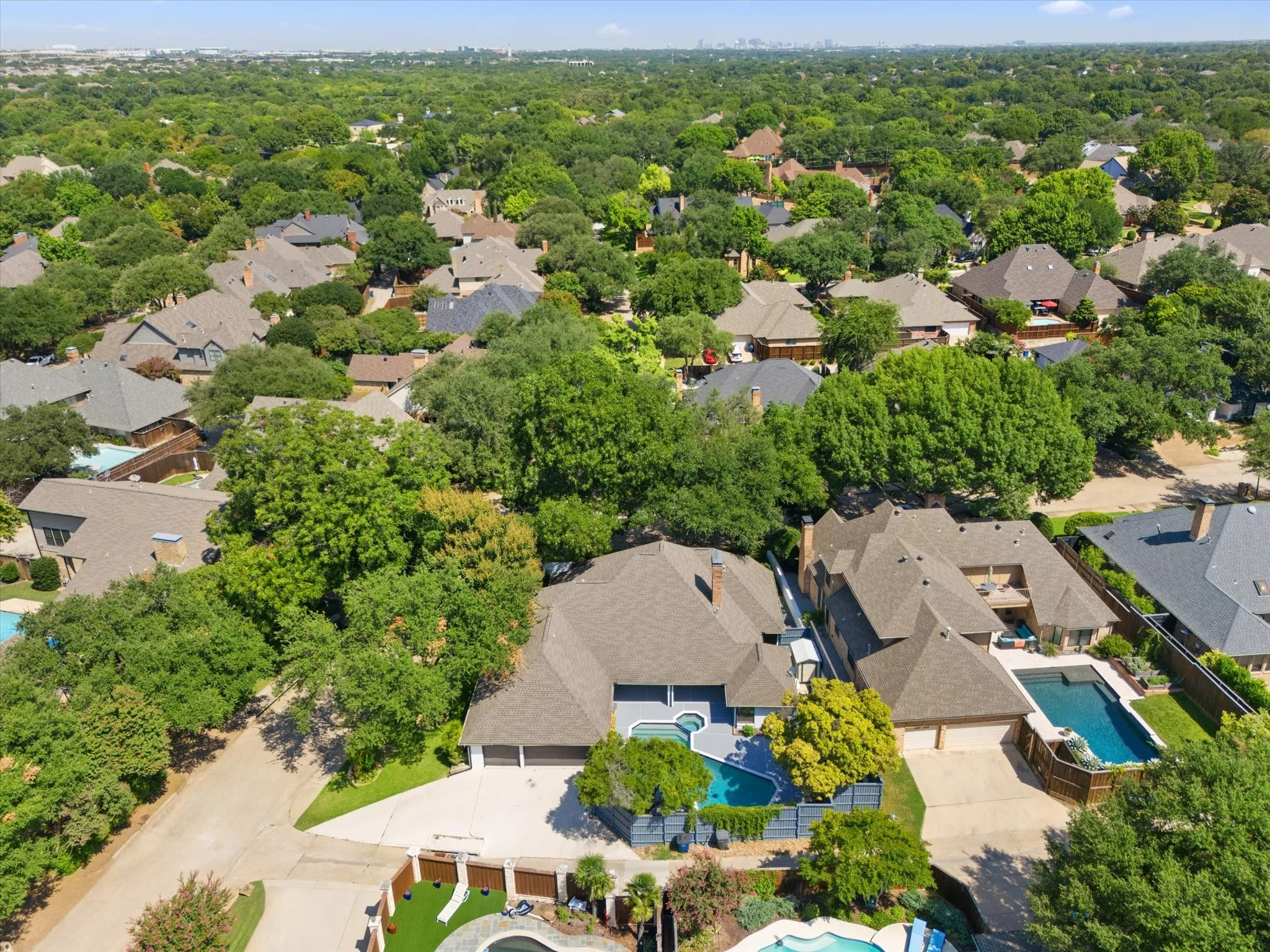 Aerial perspective of suburban area with a pool area