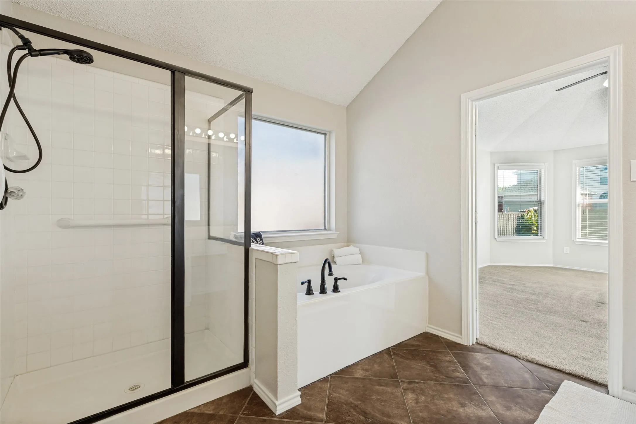 Separate shower & soaking tub plus a large walk in closet