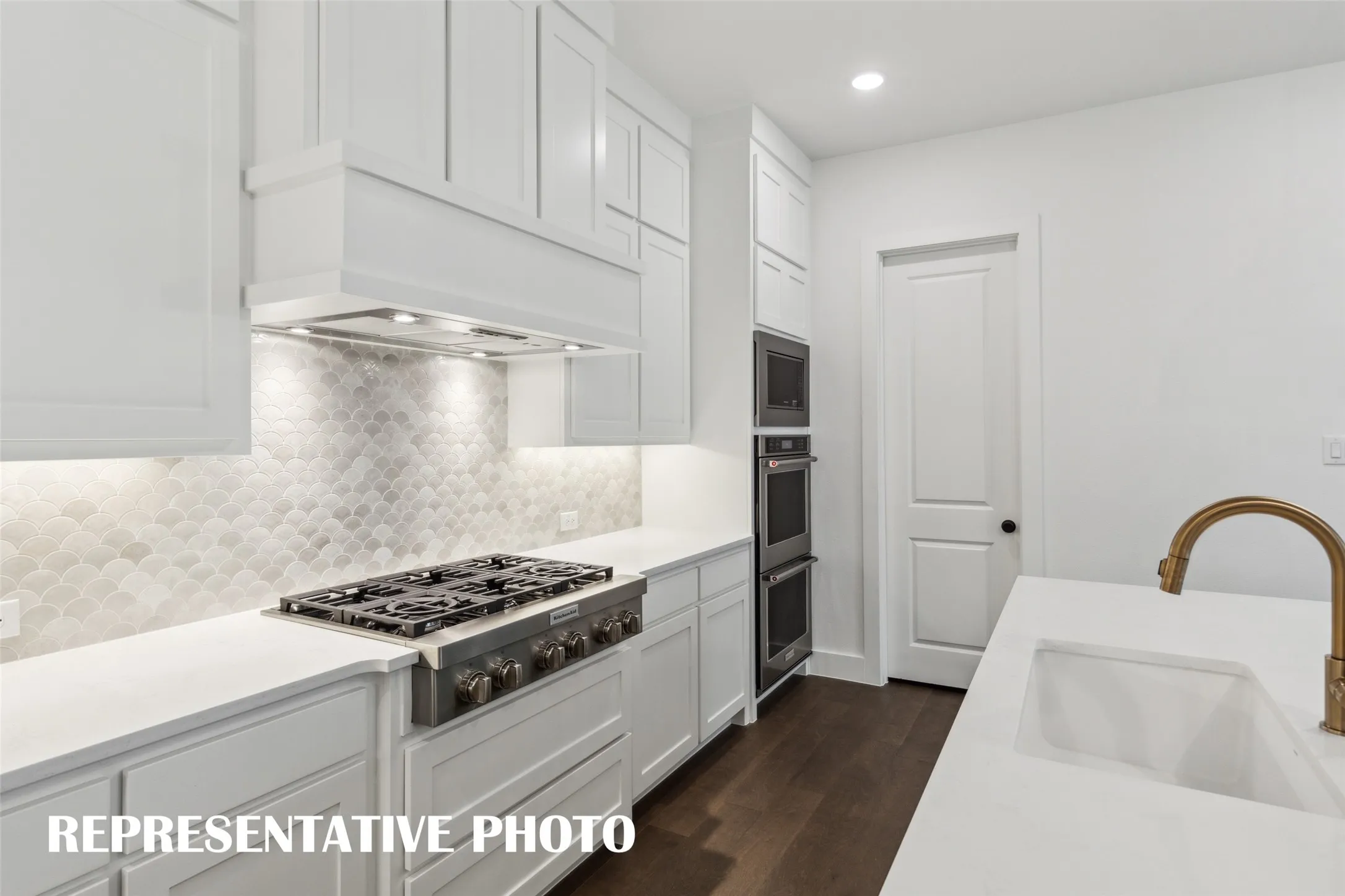 Complete with beautiful cabinetry, gorgeous countertops, designer backsplsh and modern stainless steel, any chef would be proud to call this kitchen their own!  REPRESENTATIVE PHOTO