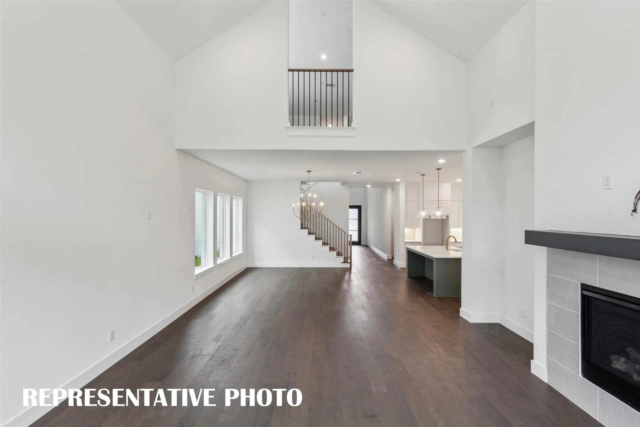 With sight lines from the front to the back of the home and an upstairs overlook, the entire family will love this over the top home!  REPRESENTATIVE PHOTO