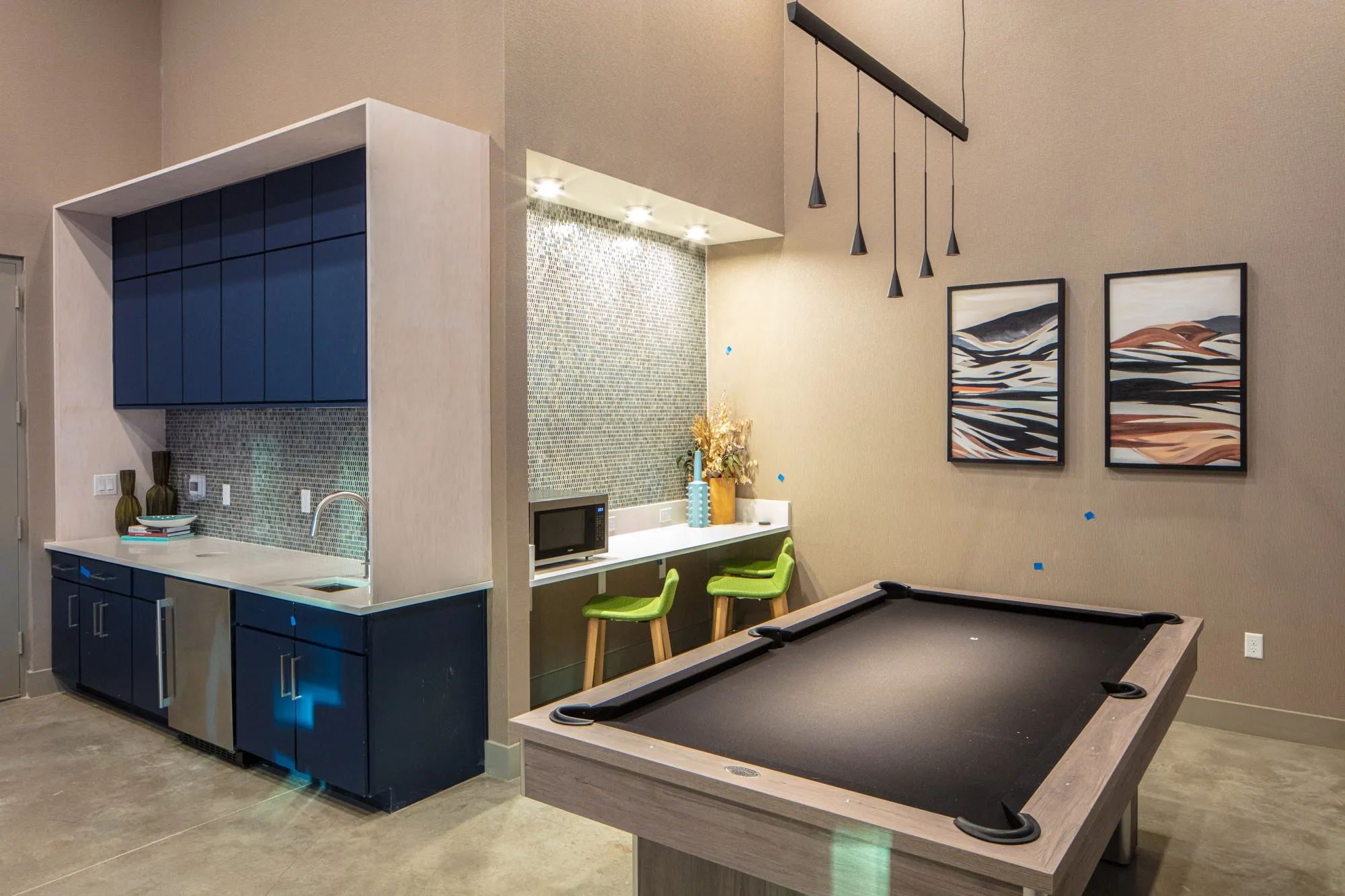 Recreation room with a towering ceiling, billiards, and sink