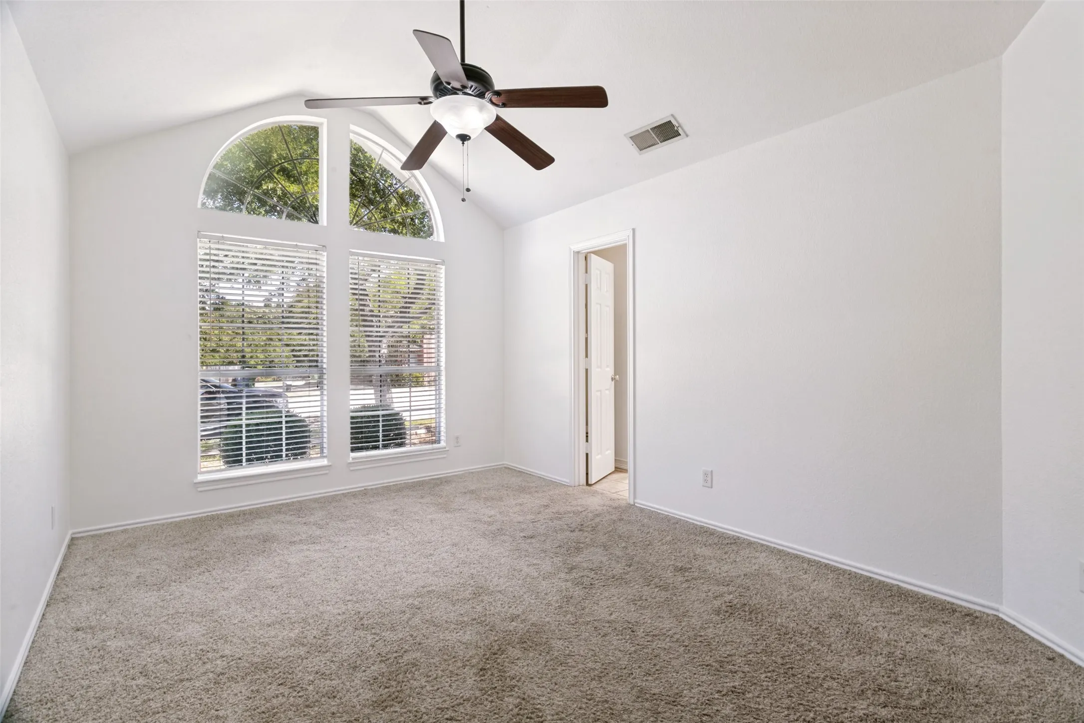 Oversized Primary bdrm with vaulted ceiling, ensuite full bath & fresh paint.