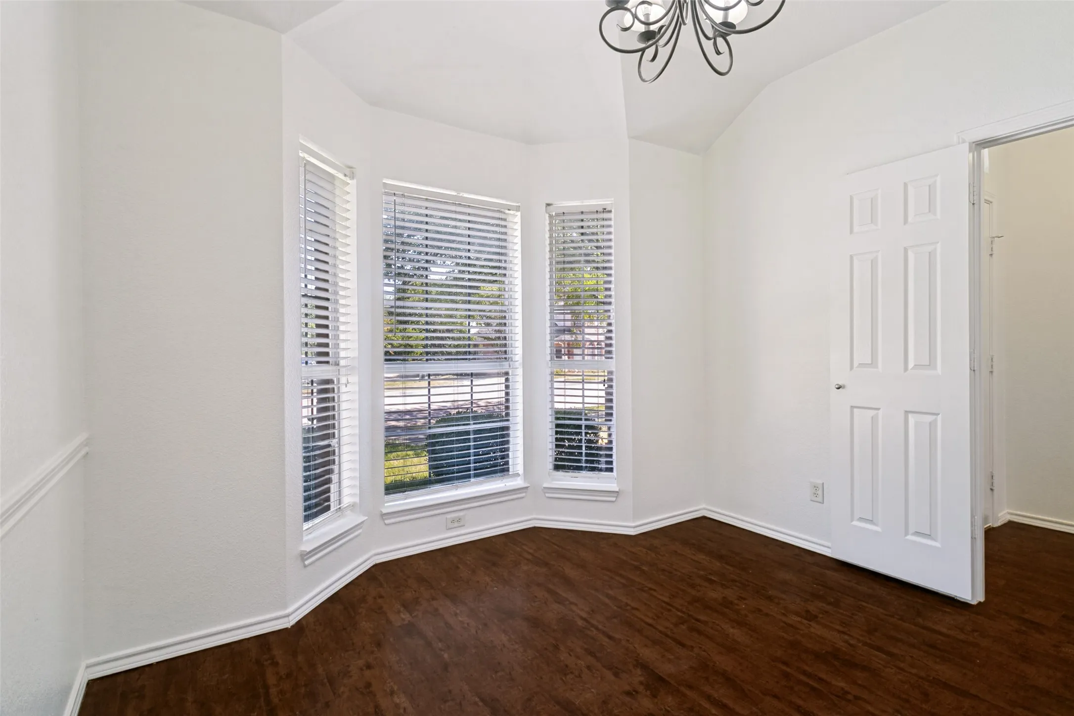 Spacious dining room that can also be an office or another living area.