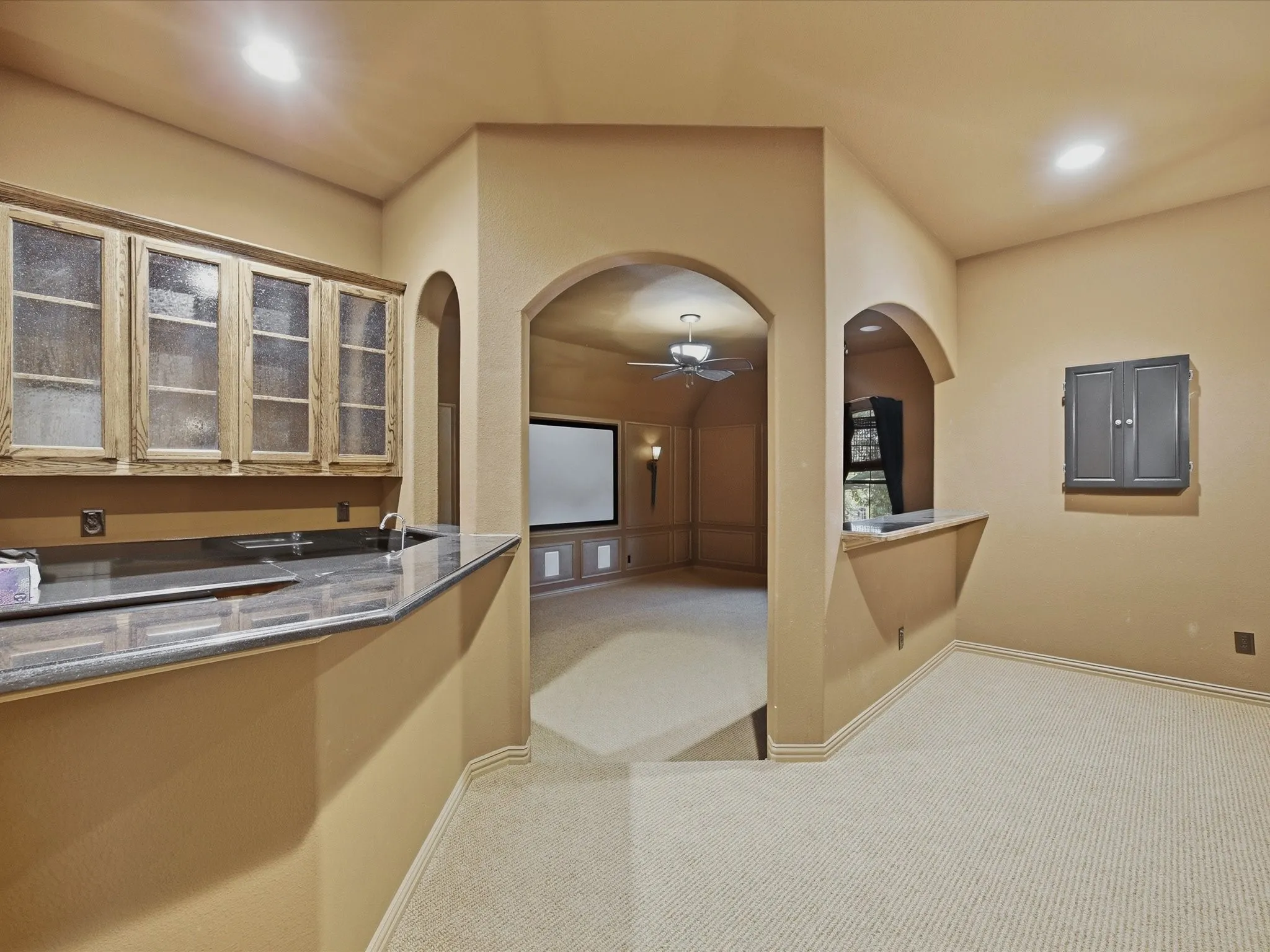 Wet bar in Game Room leading to Media Room
