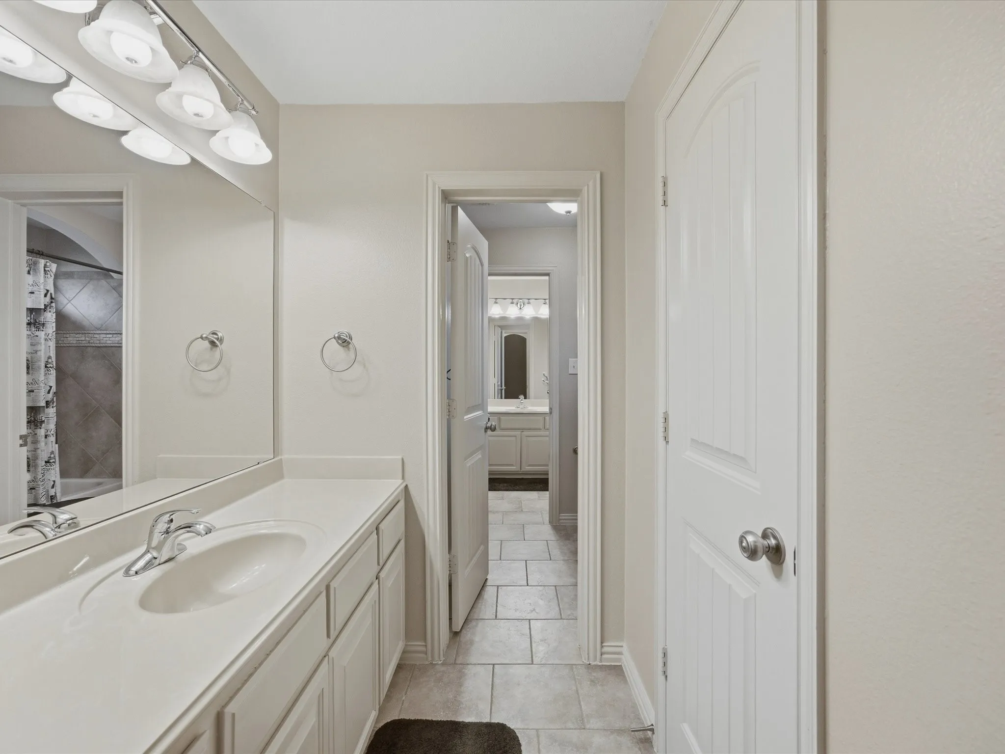 Extended vanity with an integrated sink and chrome faucet
