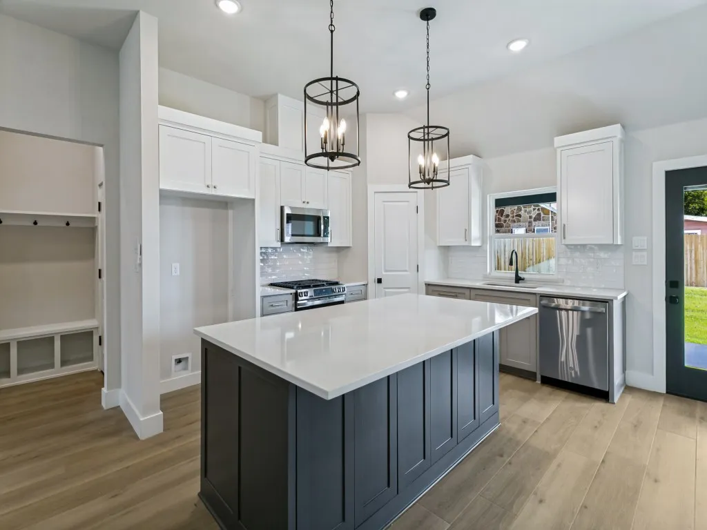 Large Island with Quartz and Pendant Lighting