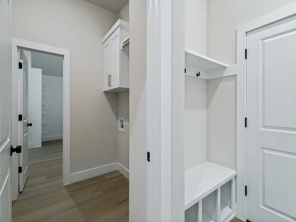 Laundry Room Opens to the Primary Closet