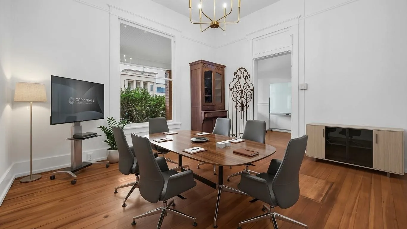 Hardwood flooring, high ceilings, large window, decorative trim, and an elegant chandelier