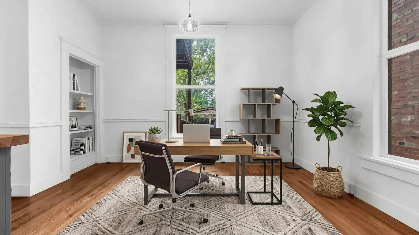 Hardwood flooring, built-in shelving, wainscoting, large windows, and a clear glass pendant light fixture