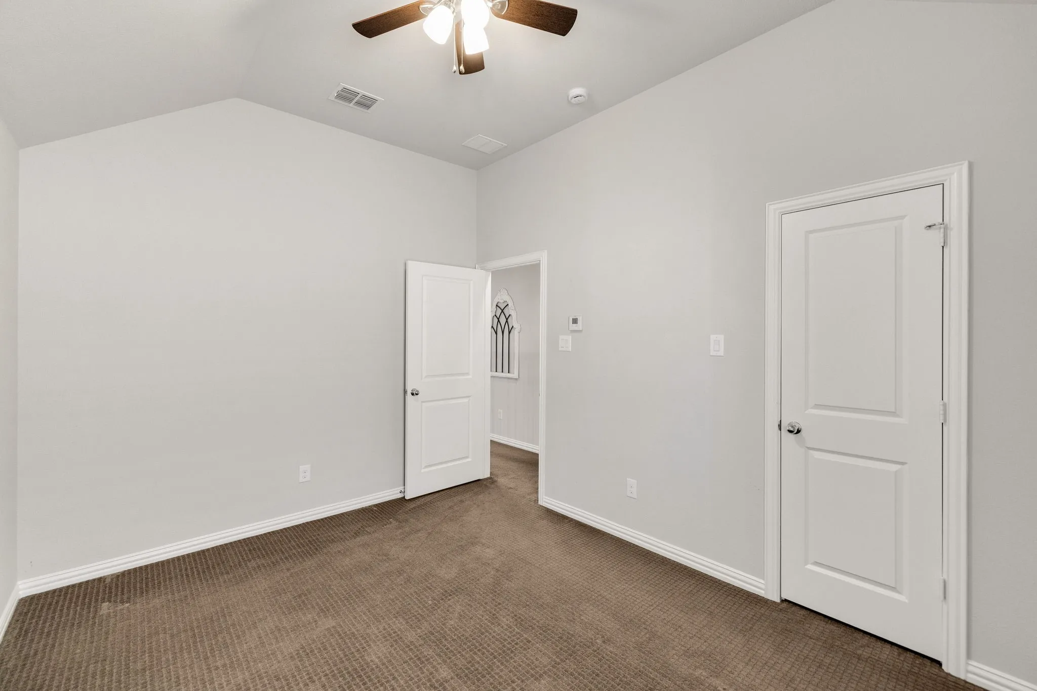 Upstairs bedroom with walk-in​​‌​​​​‌​​‌‌​‌‌​​​‌‌​‌​‌​‌​​​‌​​ closet.